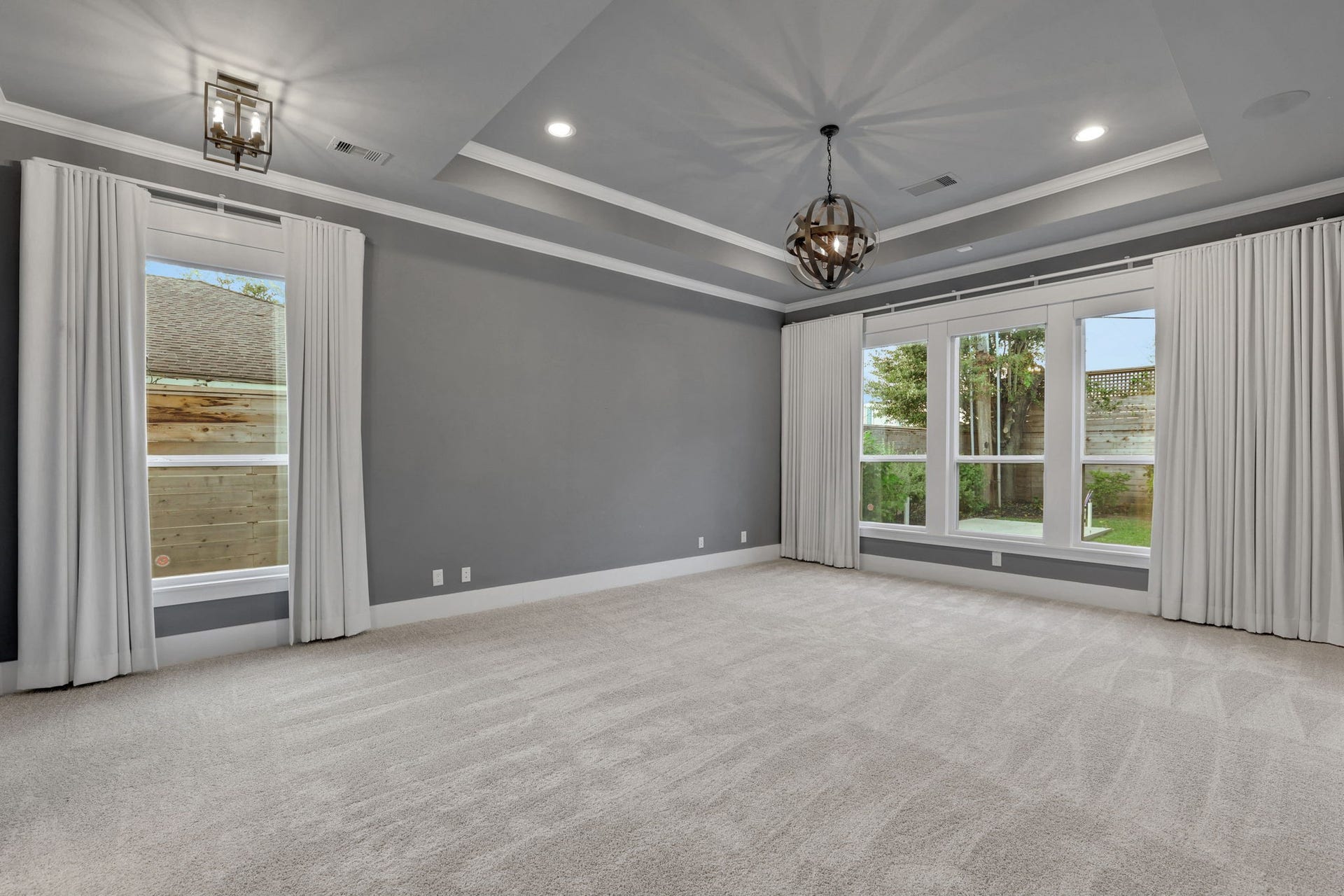 8558 Ridgepoint Drive, Houston, TX 77055 Natural light and a tray ceiling define this bedroom.