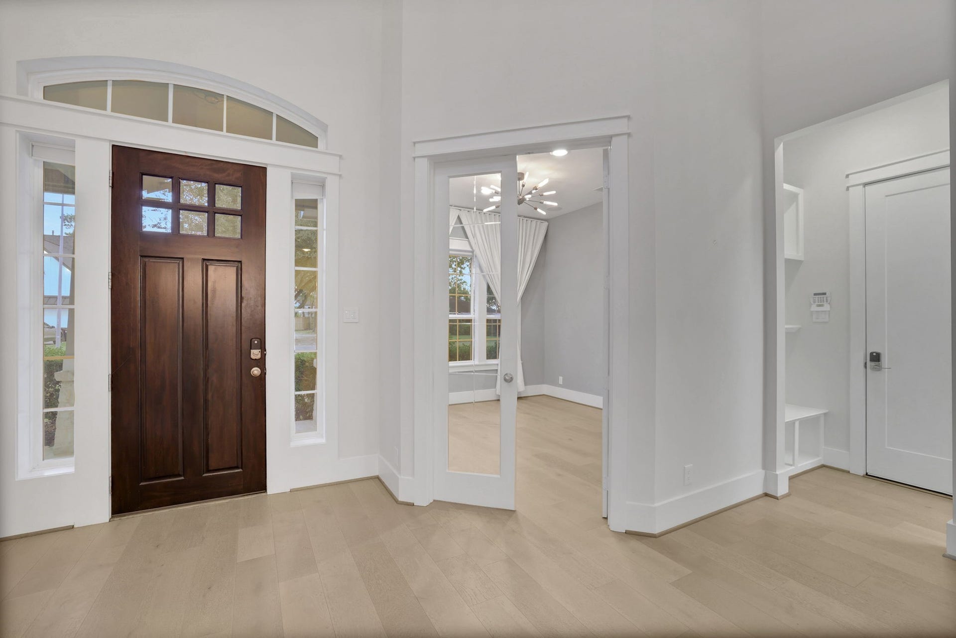 8558 Ridgepoint Drive, Houston, TX 77055 A tall foyer and solid wood front door set the tone inside.