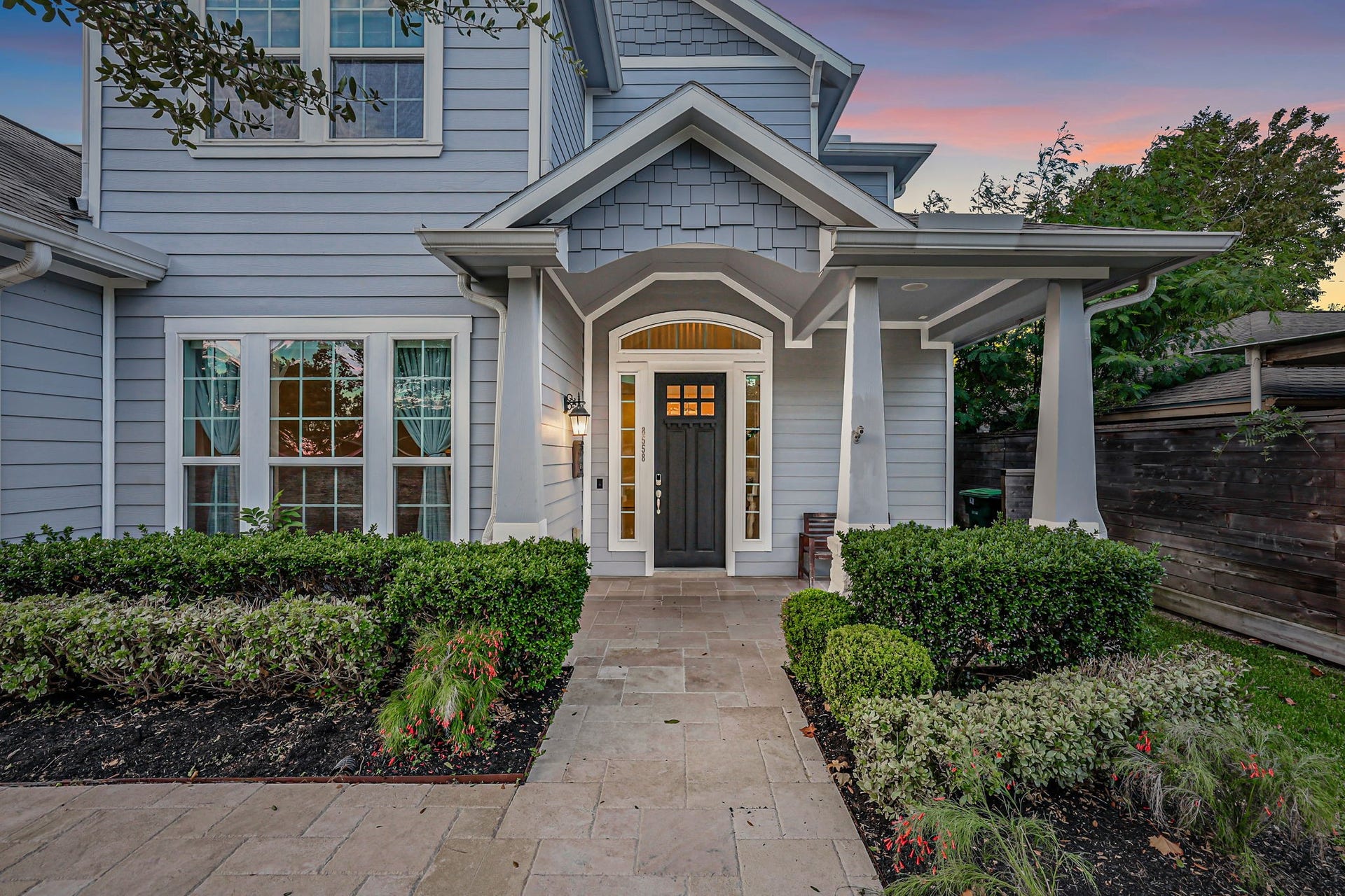 8558 Ridgepoint Drive, Houston, TX 77055 A landscaped walk leads to the covered front entry.