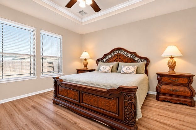 Privately located primary bedroom featuring crown molding and new floors, 1st floor