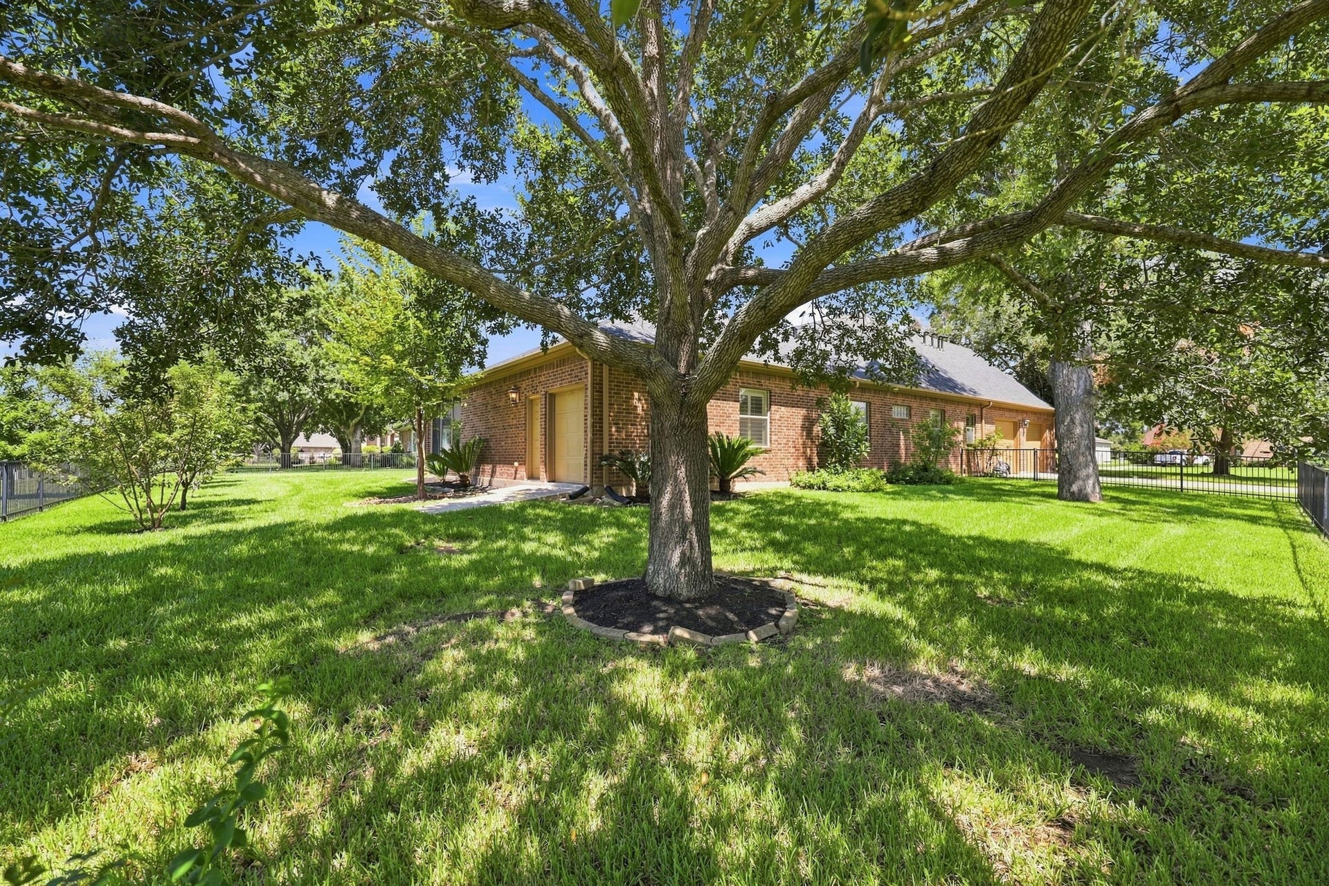 5411 Woodbury Street, Fulshear, TX 77441 Along with the oversized two-car garage, the property offers additional outdoor storage space along the side of the home. This convenient space is perfect for storing lawn equipment, a golf cart, bicycles, tools, and other outdoor essentials, keeping everything organized and easily accessible measuring approximately 9 x 11.