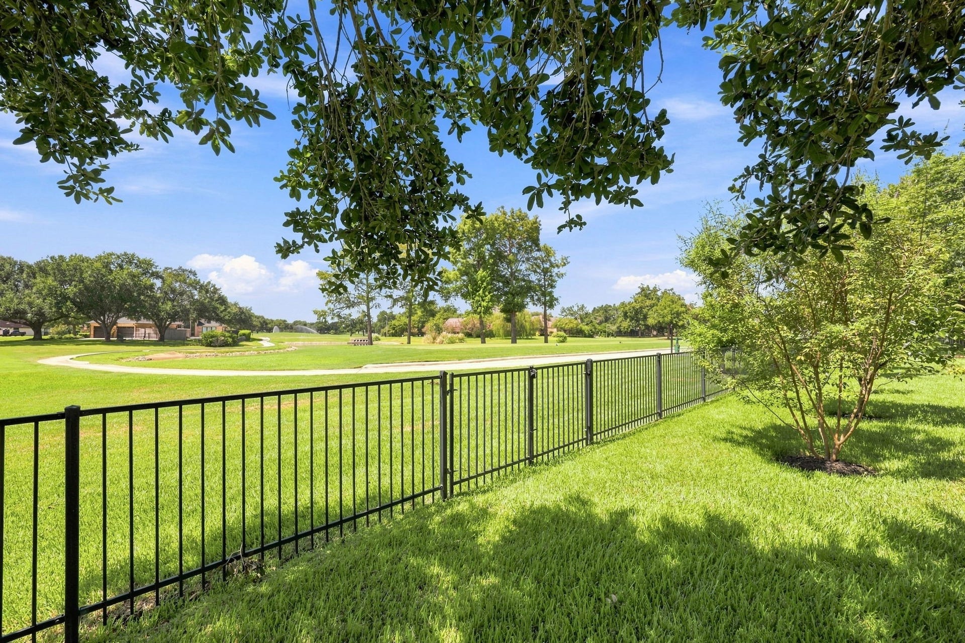 5411 Woodbury Street, Fulshear, TX 77441 This gorgeous view looks directly toward the 2nd tee box of the golf course, showcasing the homes exceptional location and beautiful golf course backdrop. The peaceful setting and open views create a picturesque atmosphere to enjoy from the property.