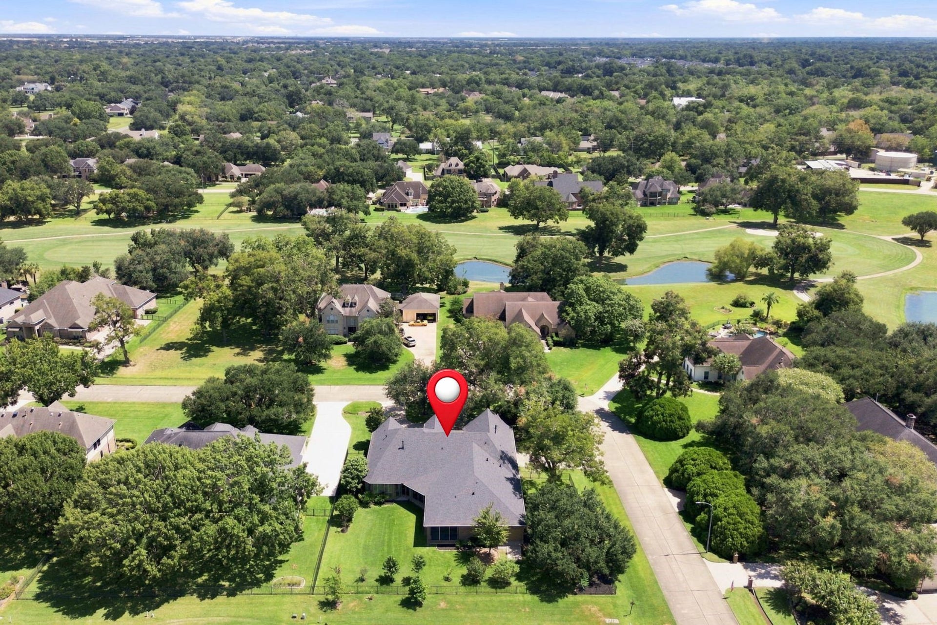 5411 Woodbury Street, Fulshear, TX 77441 This view looks east across the surrounding area, offering another beautiful perspective of the homes peaceful setting and the natural beauty that surrounds the property.