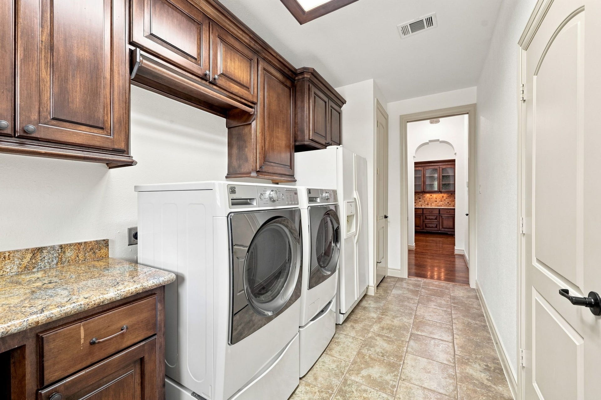 5411 Woodbury Street, Fulshear, TX 77441 The Laundry Room also includes a washer and dryer, along with a second refrigerator, all of which will remain with the home. Two additional storage closets provide even more convenient space for household essentials, linens, and supplies.