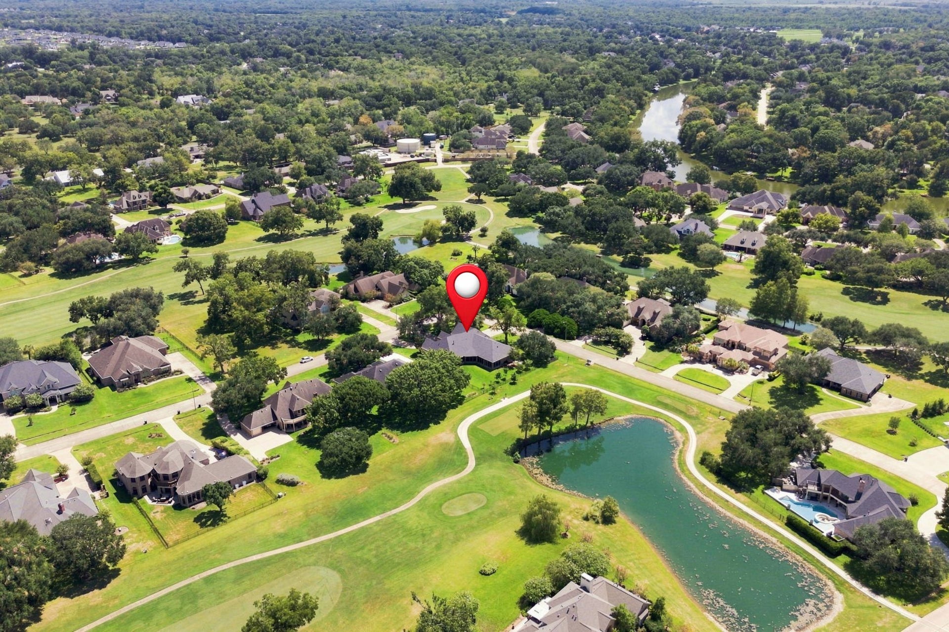 5411 Woodbury Street, Fulshear, TX 77441 This view looks south across the surrounding area and shows the golf course meandering through the neighborhood.