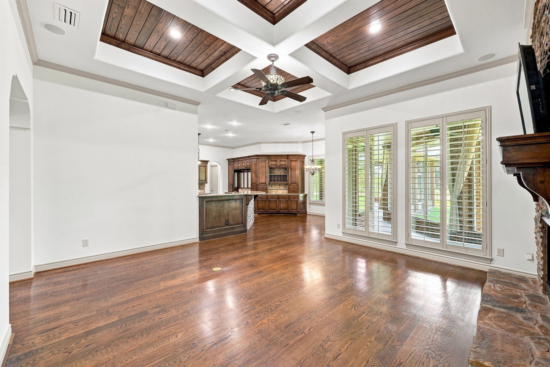 5411 Woodbury Street, Fulshear, TX 77441 This view from a different angle looks toward the Kitchen and Breakfast area, showcasing the open-concept design and easy flow between the main living spaces.