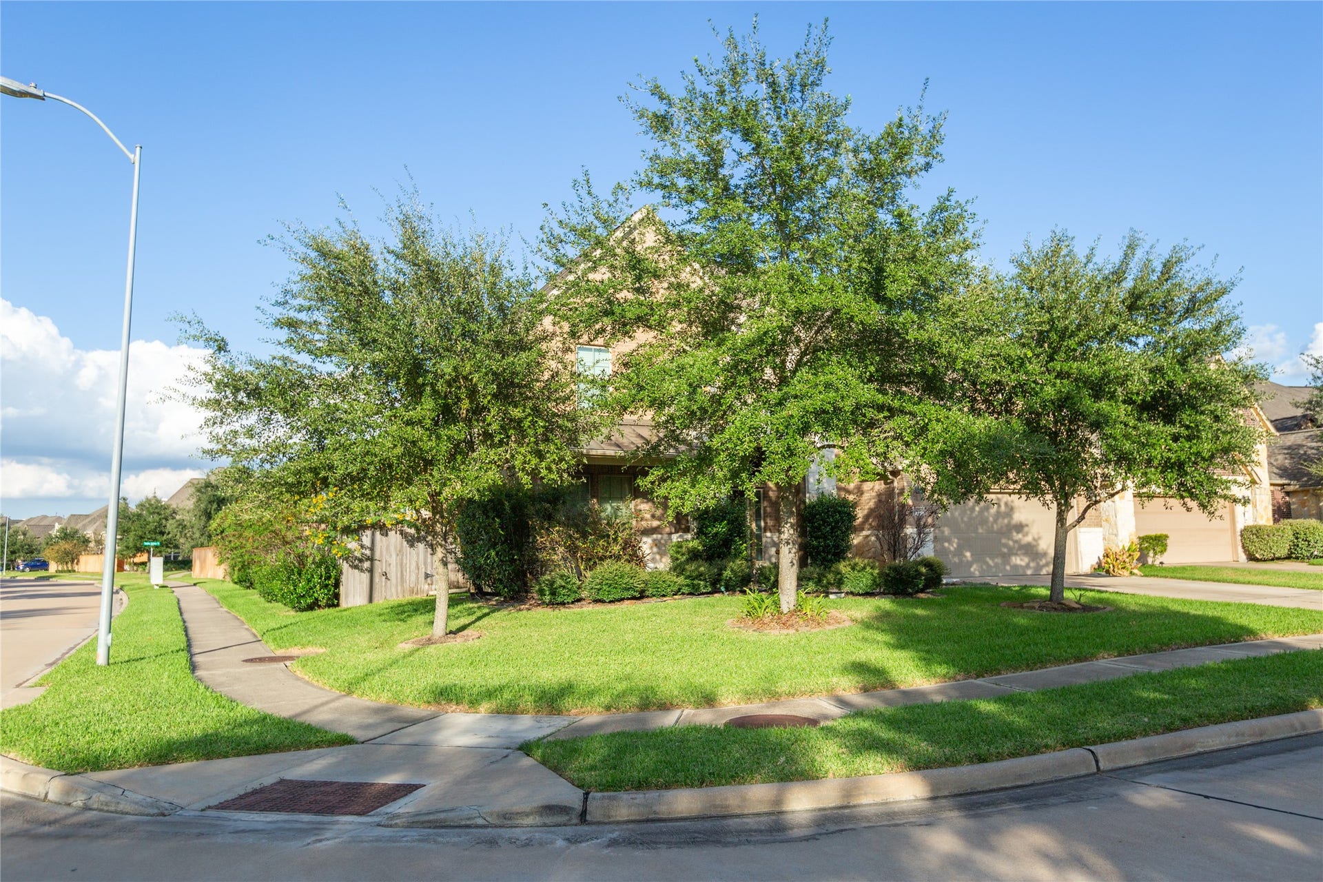 21014 Brunson Falls Drive, Richmond, TX 77407 Corner lot of the entrance to cul-de-sac