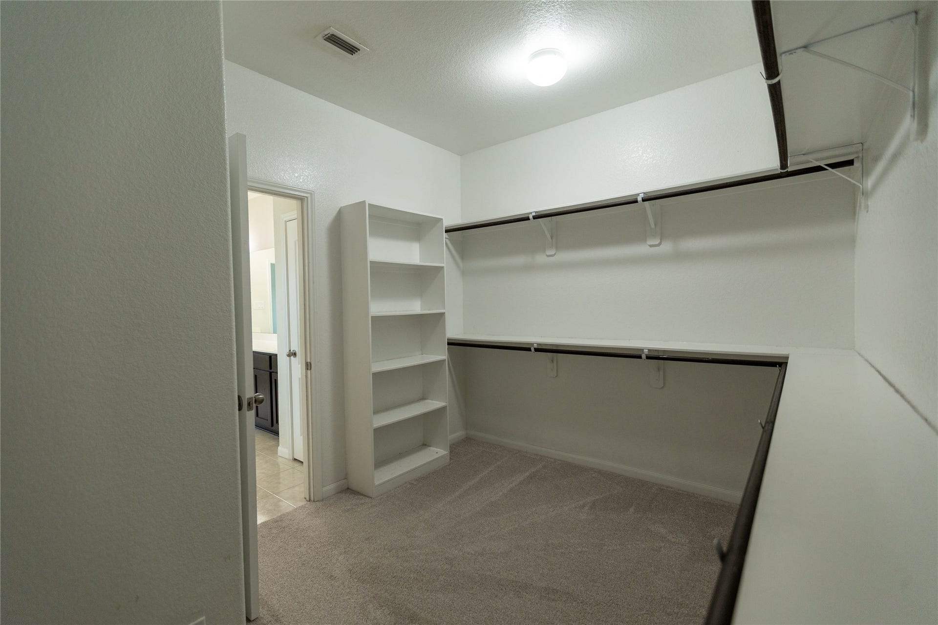 21014 Brunson Falls Drive, Richmond, TX 77407 Primary walk-in closet
