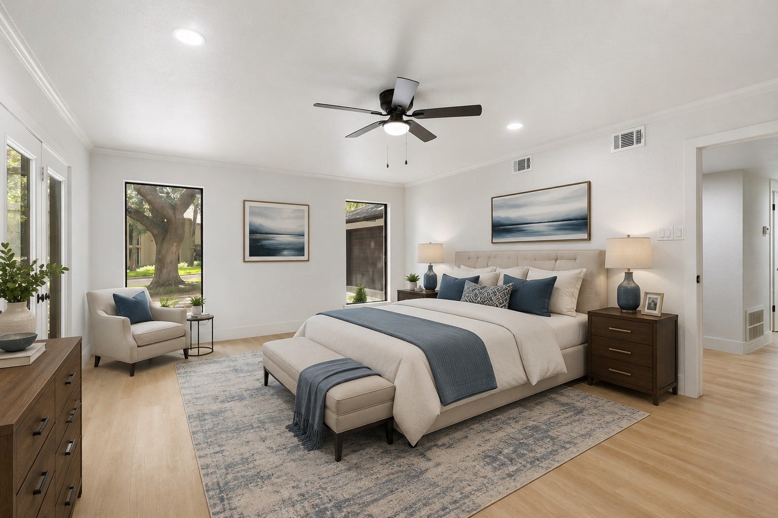 190 Dawns Edge Drive, Montgomery, TX 77356 The inviting primary bedroom is surrounded by windows that fill the room with natural light, complemented by recessed lighting and elegant crown molding. (Furniture has been virtually staged)
