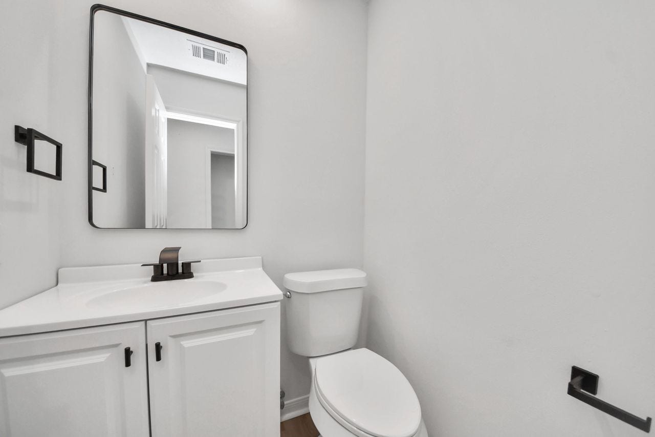 15047 Tramore Drive, Houston, TX 77083 Even the smallest spaces get a thoughtful refresh. Crisp white cabinetry, a clean-lined vanity, modern fixtures, and a simple framed mirror give this guest bath a fresh, polished feel.