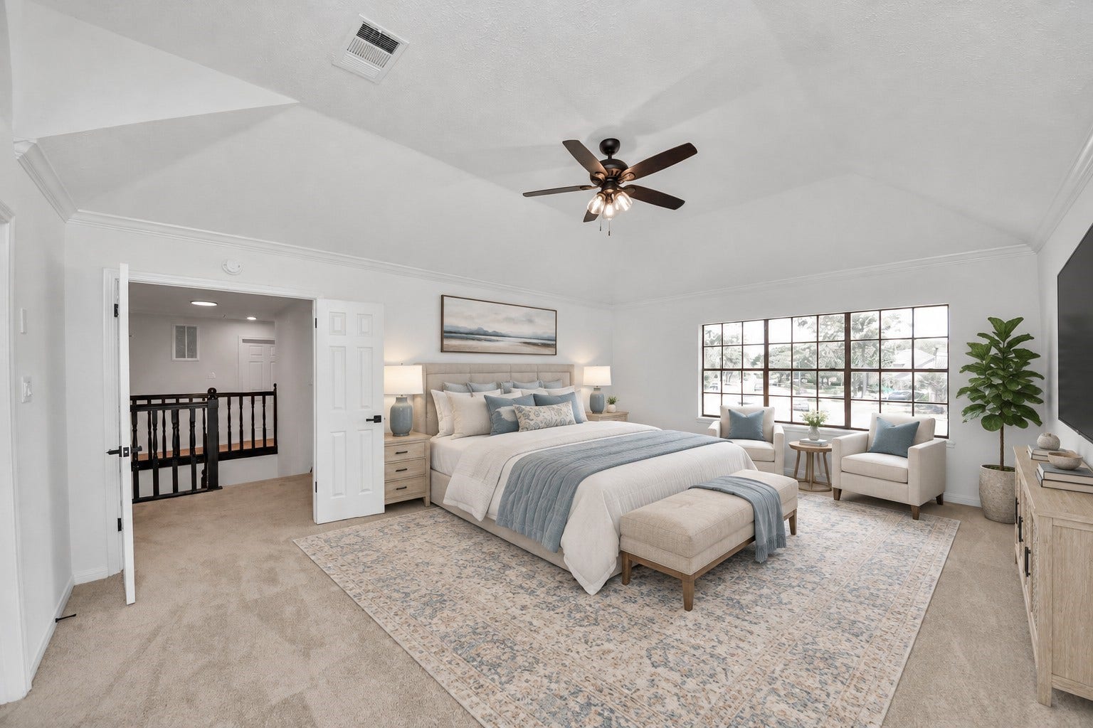 15047 Tramore Drive, Houston, TX 77083 A virtually staged primary bedroom shows one of many design layouts for this over-sized room with large windows, bringing in an abundance of natural light.