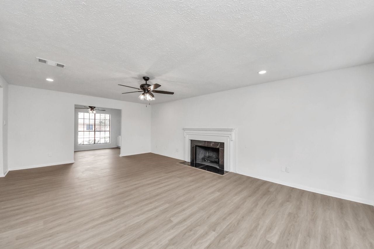 15047 Tramore Drive, Houston, TX 77083 From the main living area, a separate room offers a quieter place to work or unwind while remaining just steps from the heart of the home.