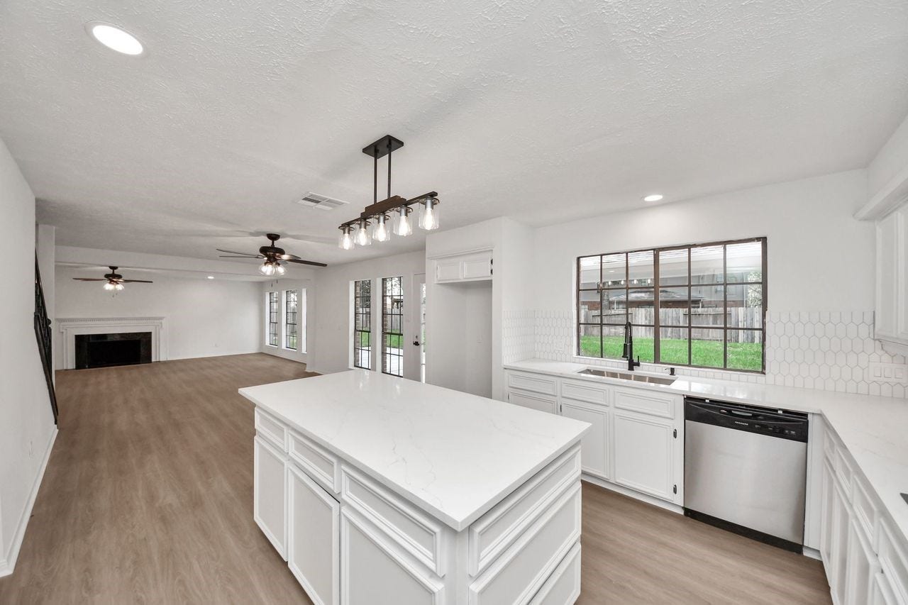 15047 Tramore Drive, Houston, TX 77083 The oversized island becomes the natural gathering point. Thoughtful finishes throughout showcase the full scope of the kitchen's renovation and makes this space as practical as it is beautiful.