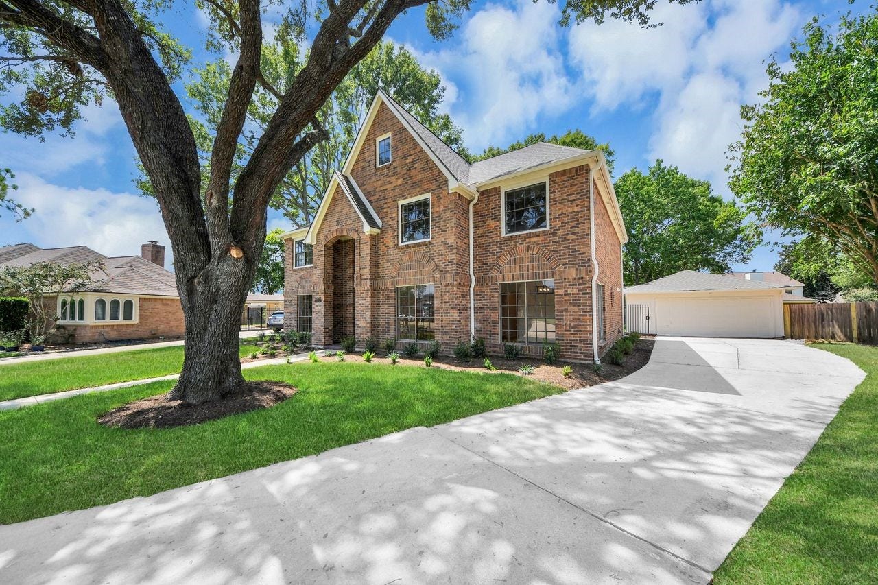 15047 Tramore Drive, Houston, TX 77083 The generous driveway leads to the detached garage, offering plenty of room for parking and everyday convenience. Set apart from the main home, the garage adds valuable flexibility. It's a practical feature that blends seamlessly into the character of the property.