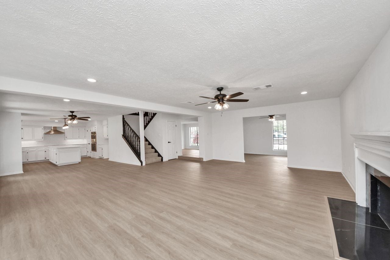 15047 Tramore Drive, Houston, TX 77083 The expansive family room provides plenty of flexibility for furniture, entertaining, and everyday life.