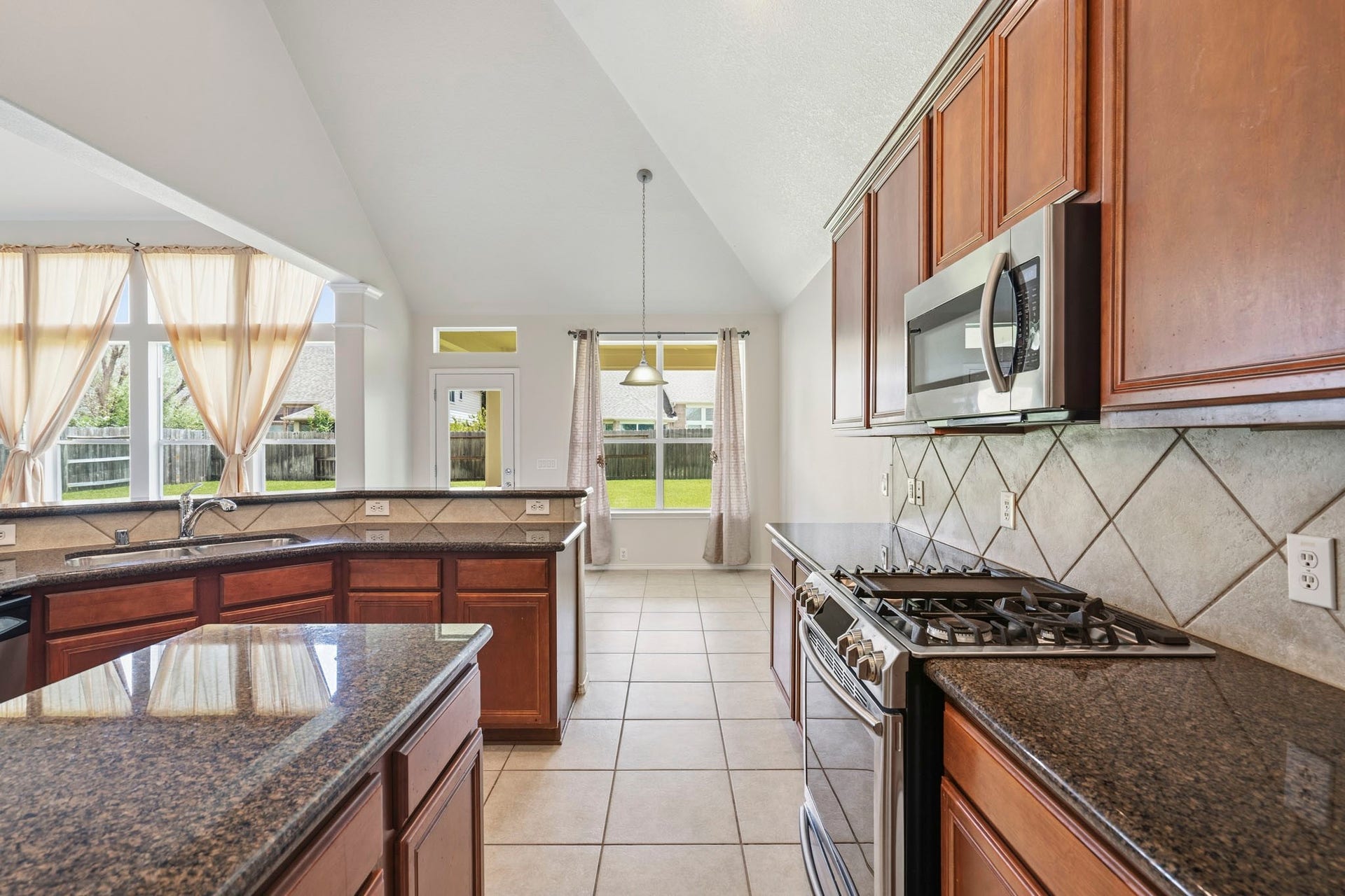 5515 Granite Meadow Drive, Katy, TX 77494 Additional view highlighting the kitchen's spacious design, abundant workspace, and easy flow into the home's main living areas.