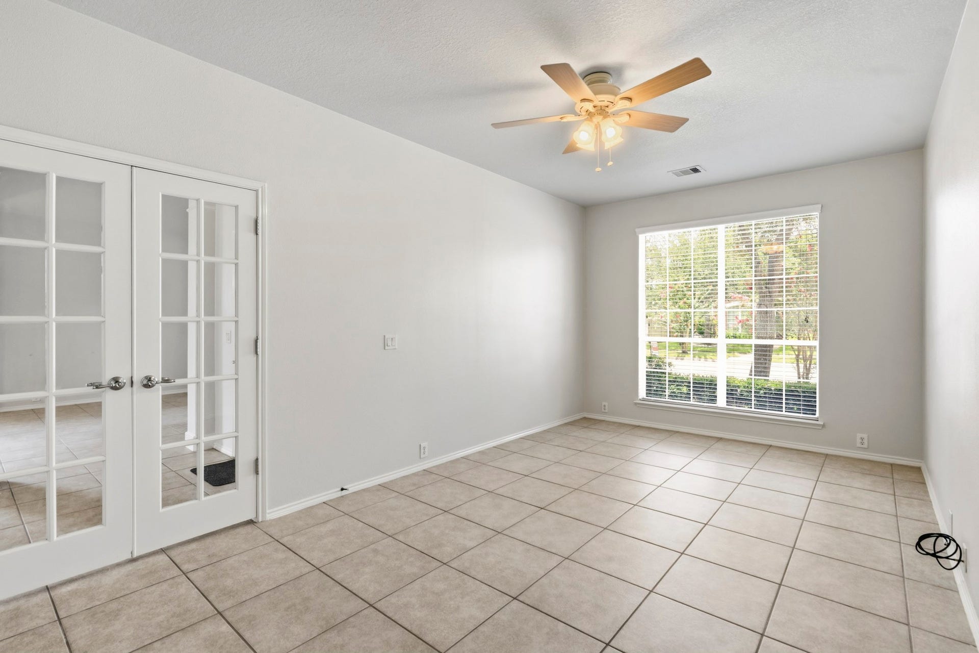 5515 Granite Meadow Drive, Katy, TX 77494 Alternate view of the study showcasing its generous size, elegant entry, and attractive views of the front lawn.