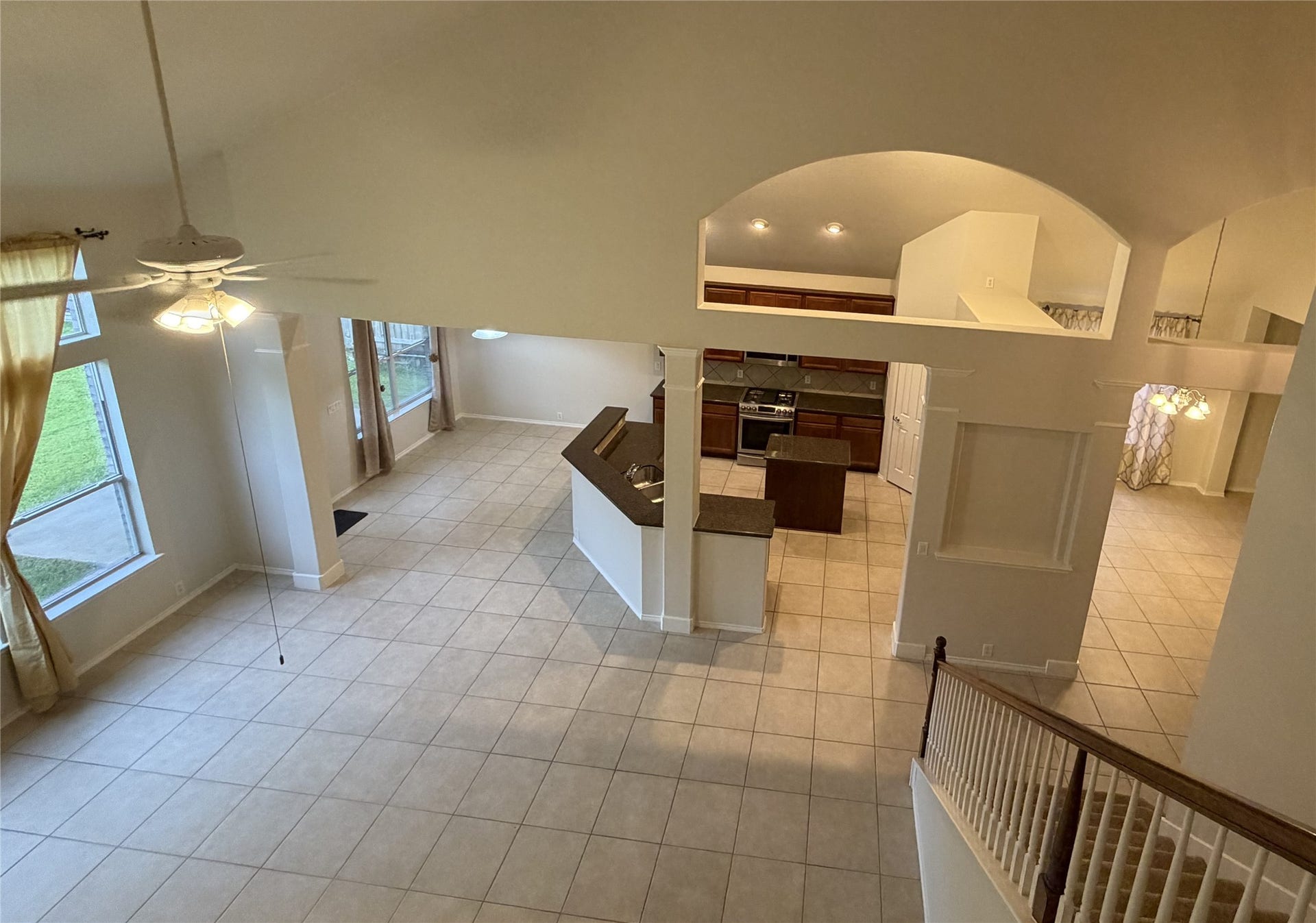 5515 Granite Meadow Drive, Katy, TX 77494 View of expansive living room, breakfast area, kitchen and formal dining and elegant architectural features