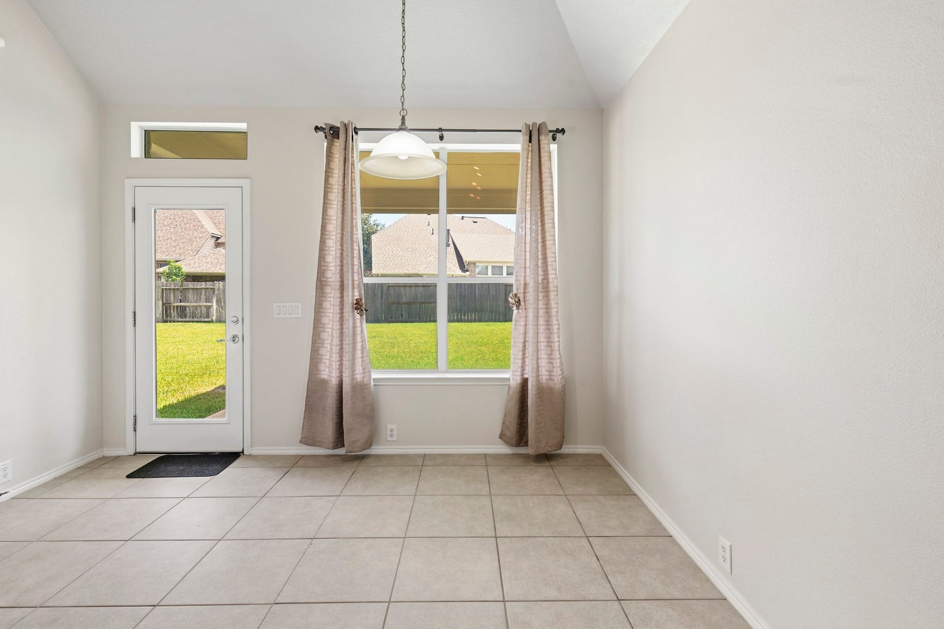 5515 Granite Meadow Drive, Katy, TX 77494 Breakfast area and rear access leading to the covered patio, creating an ideal space for outdoor grilling, dining, and entertaining.