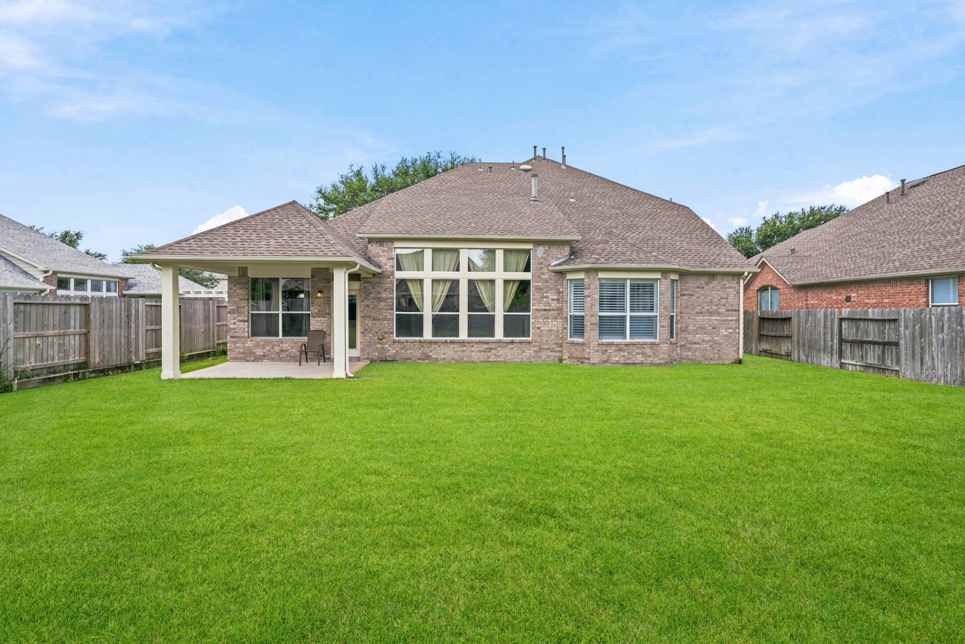 5515 Granite Meadow Drive, Katy, TX 77494 Vast pool-sized backyard featuring a covered patio, recently installed roof and gutters, and endless possibilities for outdoor living, recreation, or a future pool.