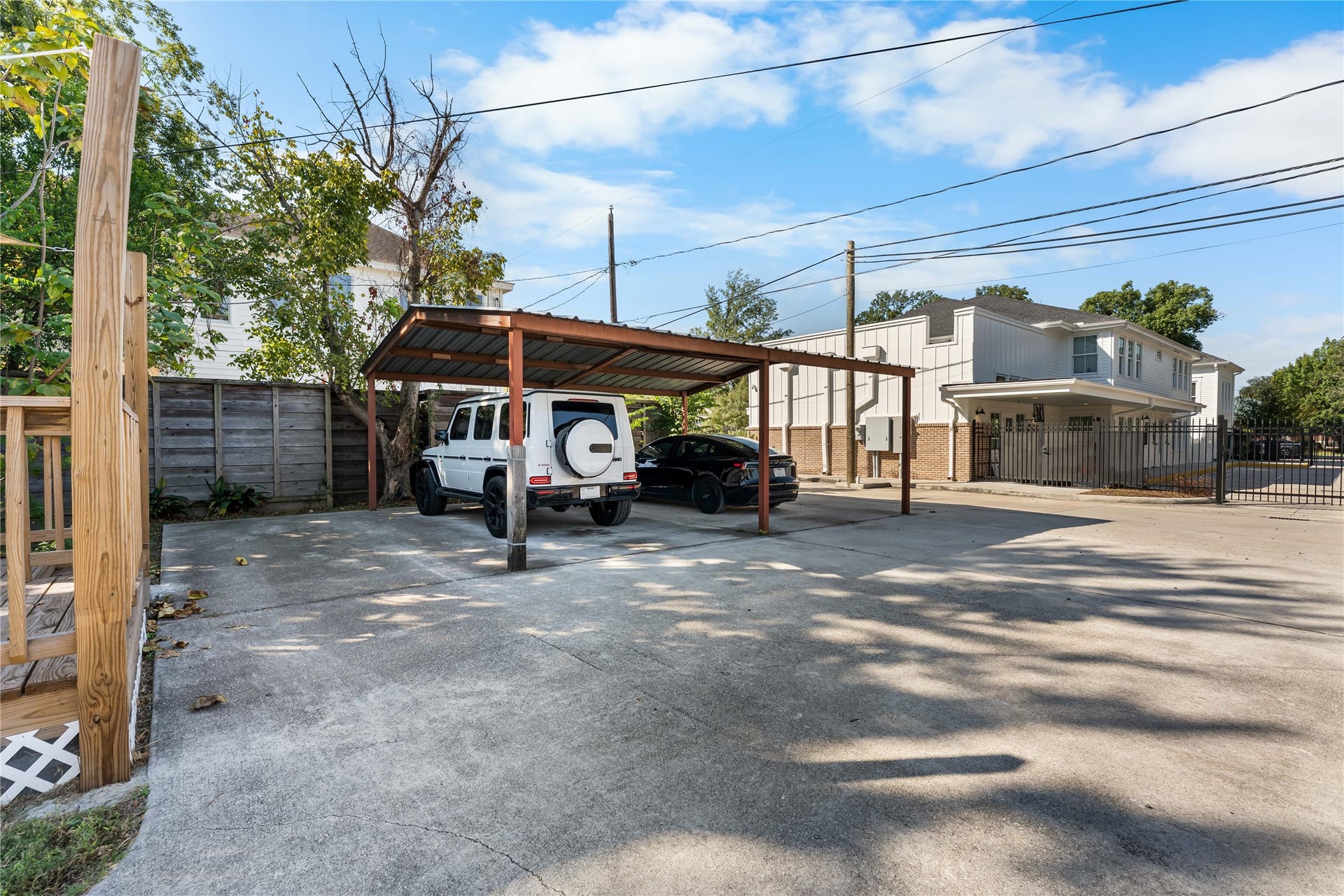 1105 Yale Street, Houston, TX 77008 Generous paved parking area with covered spaces.