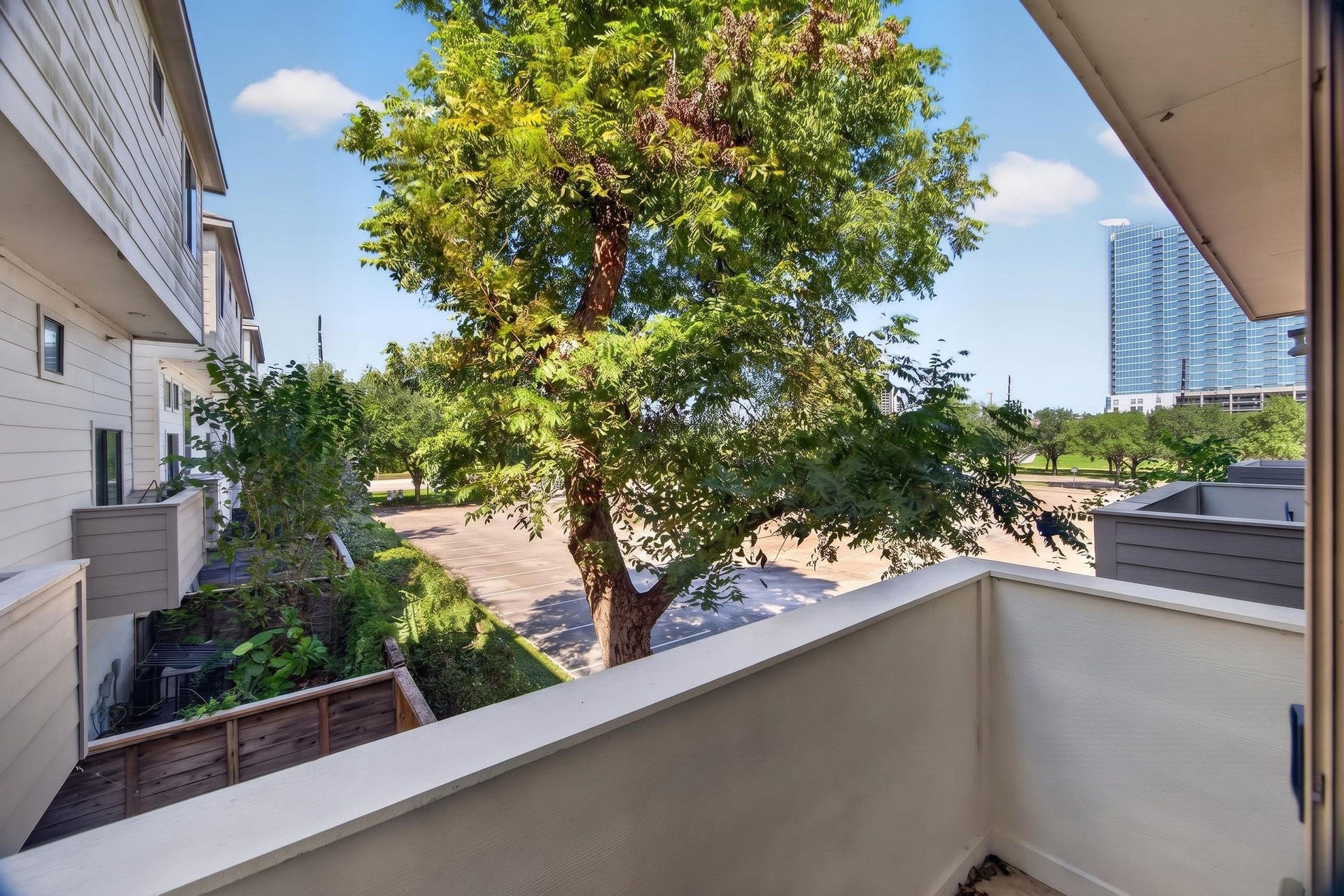 2307 Camden Drive, #C, Houston, TX 77021 Private balcony with treetop and skyline views
