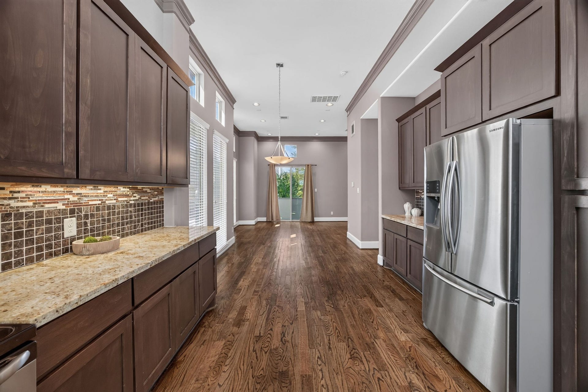 2307 Camden Drive, #C, Houston, TX 77021 French-door refrigerator with a view through to the dining area