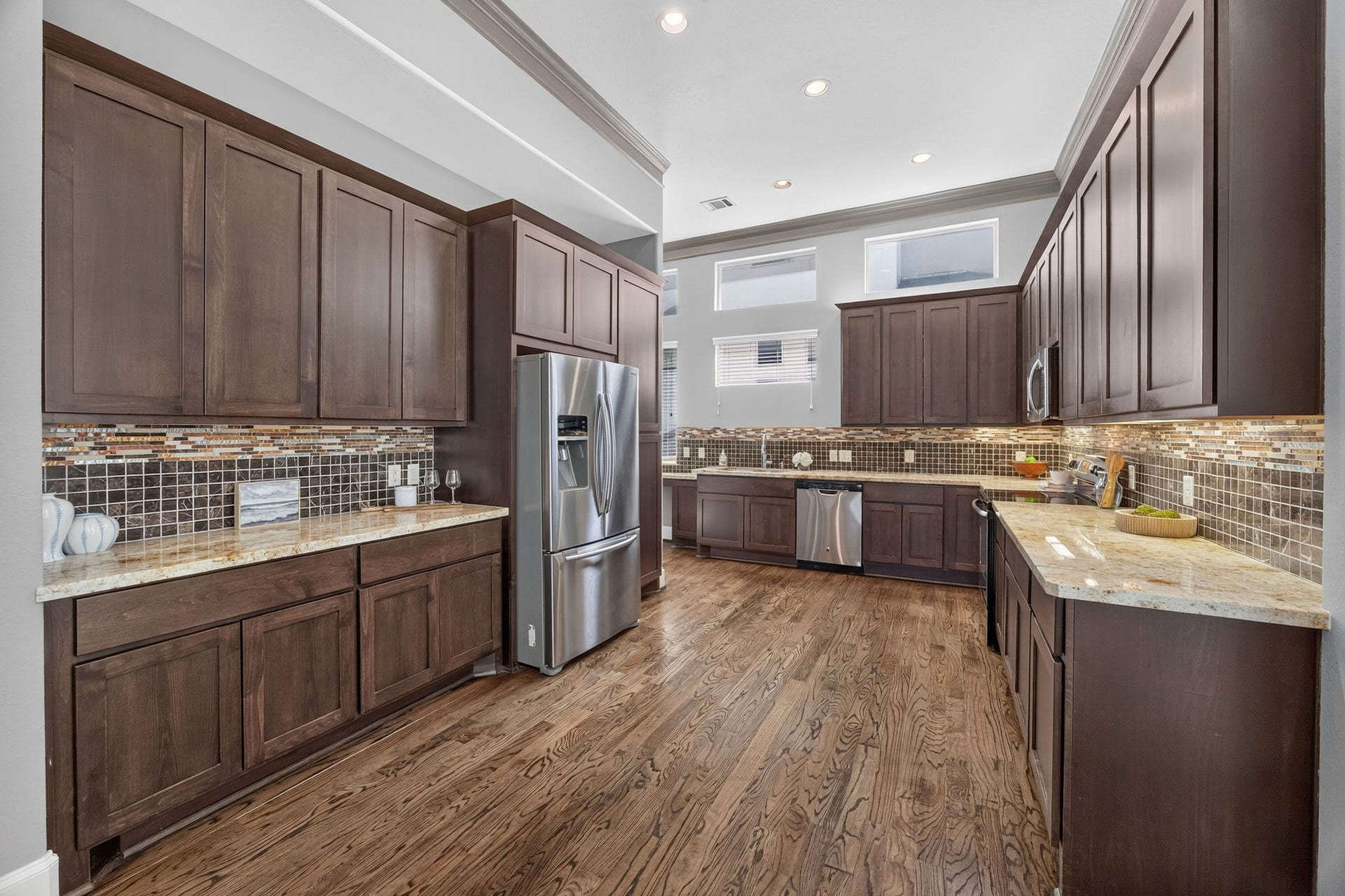 2307 Camden Drive, #C, Houston, TX 77021 Kitchen with rich wood cabinetry and stainless appliances