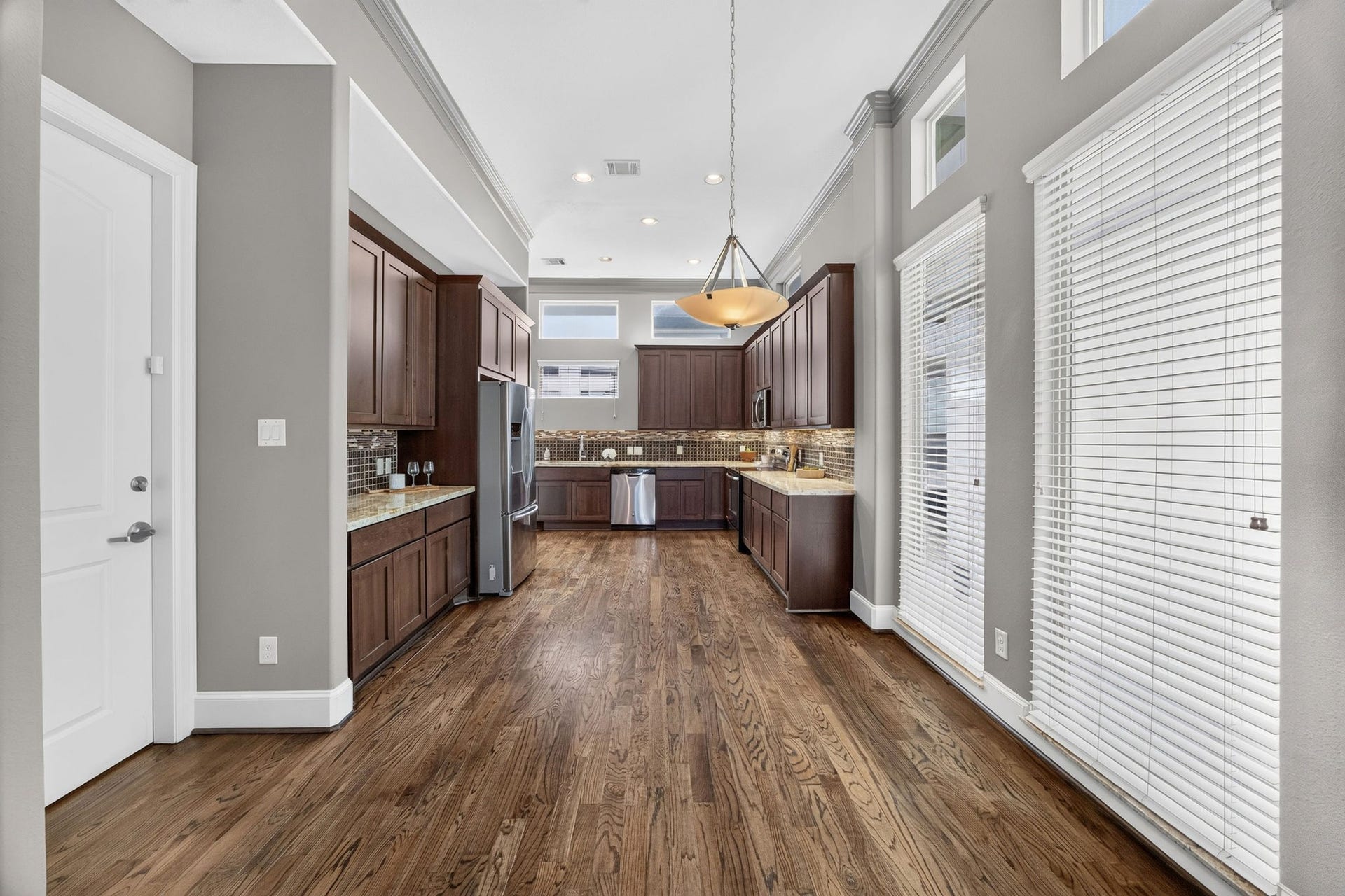 2307 Camden Drive, #C, Houston, TX 77021 Light-filled kitchen with a pendant-lit dining space