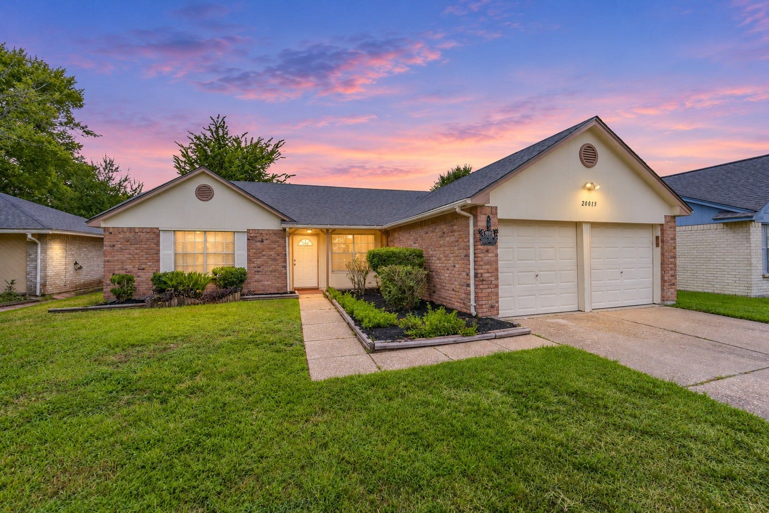 20015 Lions Gate Drive, Humble, TX 77338 Stunning elevation, fresh landscaping and mulch.