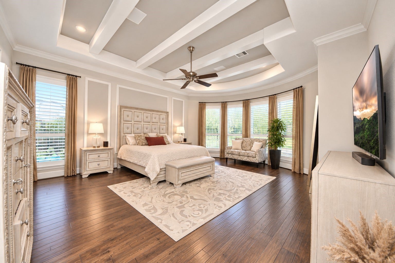 12821 N Palomino Lake Circle, Cypress, TX 77429 Expansive 19' x 20' primary suite featuring a tray-style ceiling accented with decorative beams, elegant bay windows, Plantation shutters and built-in surround sound speakers.