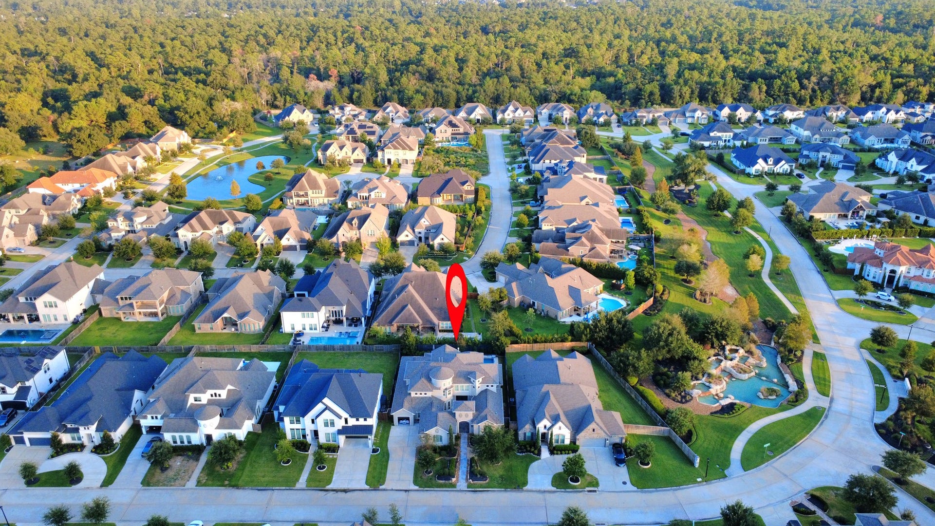 12821 N Palomino Lake Circle, Cypress, TX 77429 Experience luxury living in the prestigious gated community of Bridlecreek, featuring a scenic lake, beautiful waterfall entrance, and picturesque walking trails throughout the neighborhood.