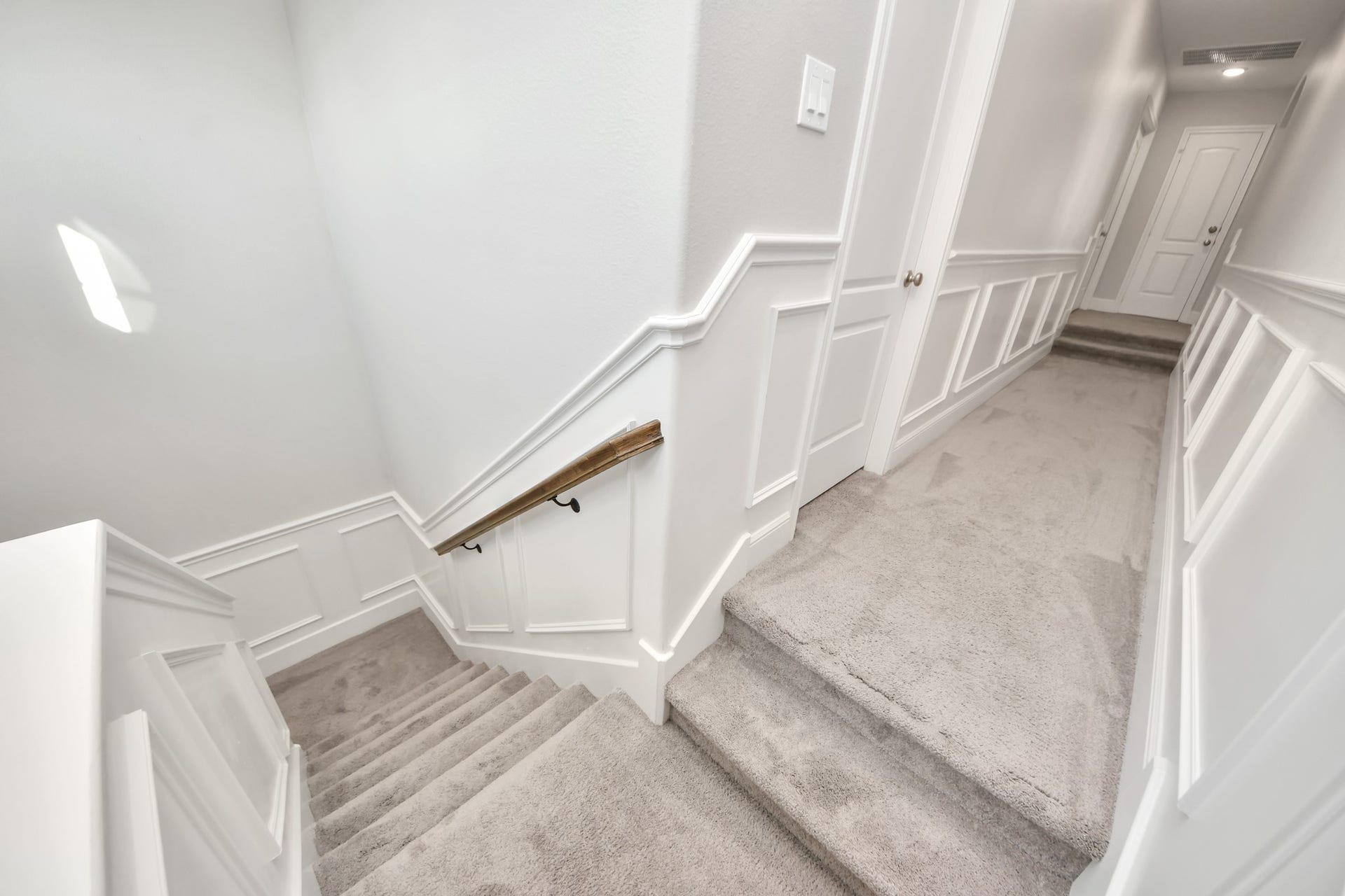 12821 N Palomino Lake Circle, Cypress, TX 77429 Convenient rear staircase providing easy access between the upstairs game room and media room and the main level, leading to the mudroom, garage entrance, breakfast area, and kitchen.