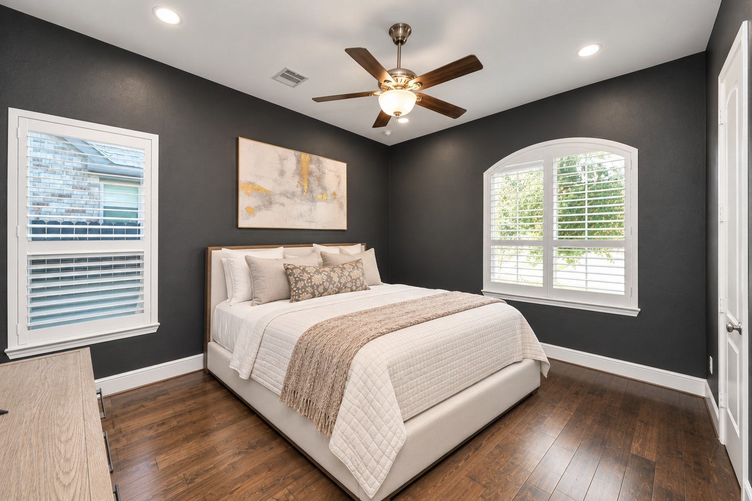 12821 N Palomino Lake Circle, Cypress, TX 77429 Private 1st floor secondary bedroom located at the front of the home, featuring plantation shutters, a secluded hallway entrance, and its own en-suite bathroom with walk-in shower.