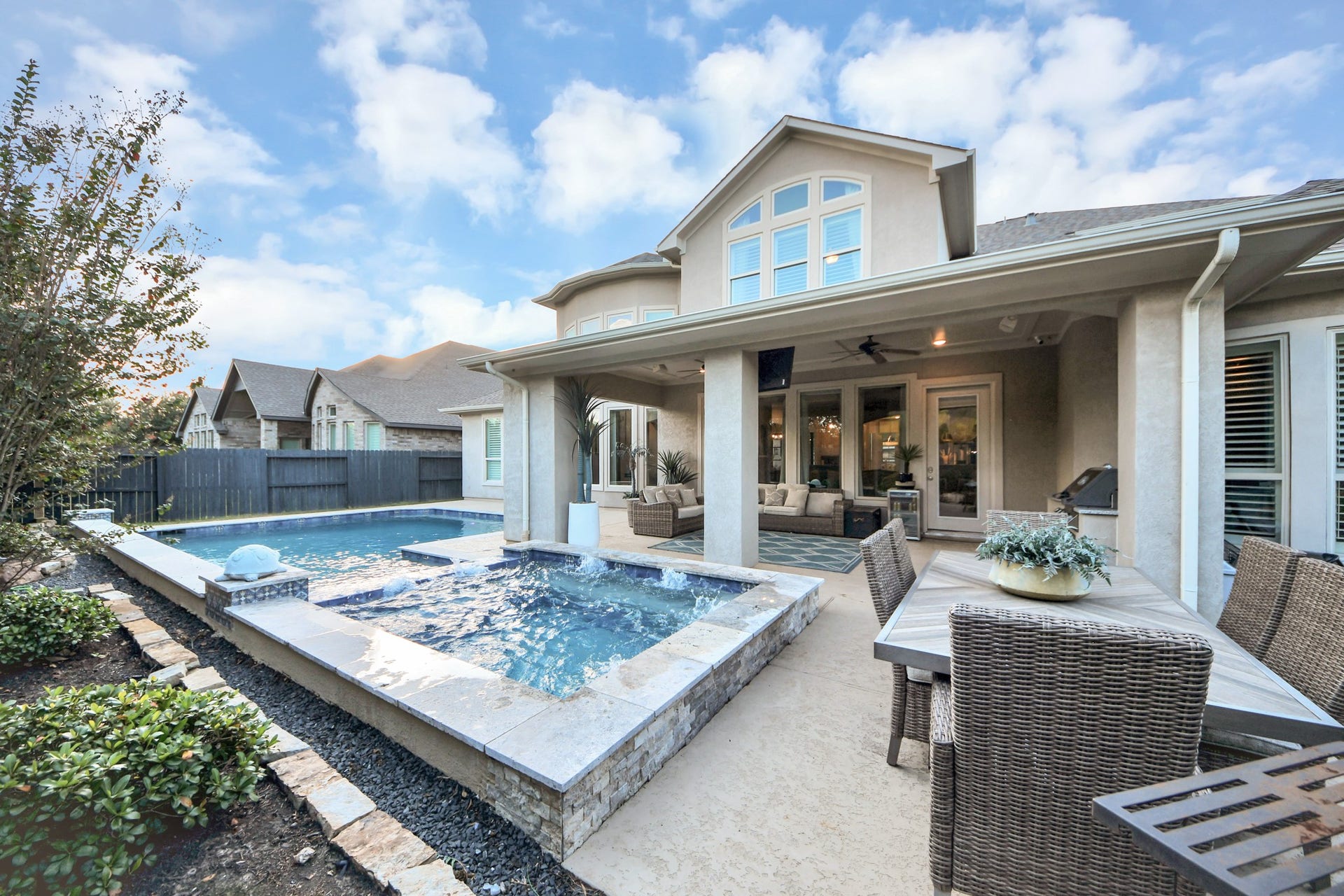 12821 N Palomino Lake Circle, Cypress, TX 77429 Oversized resort-style pool and spa surrounded by mature landscaping, offering exceptional privacy and a peaceful backyard retreat. An entertainer's paradise!