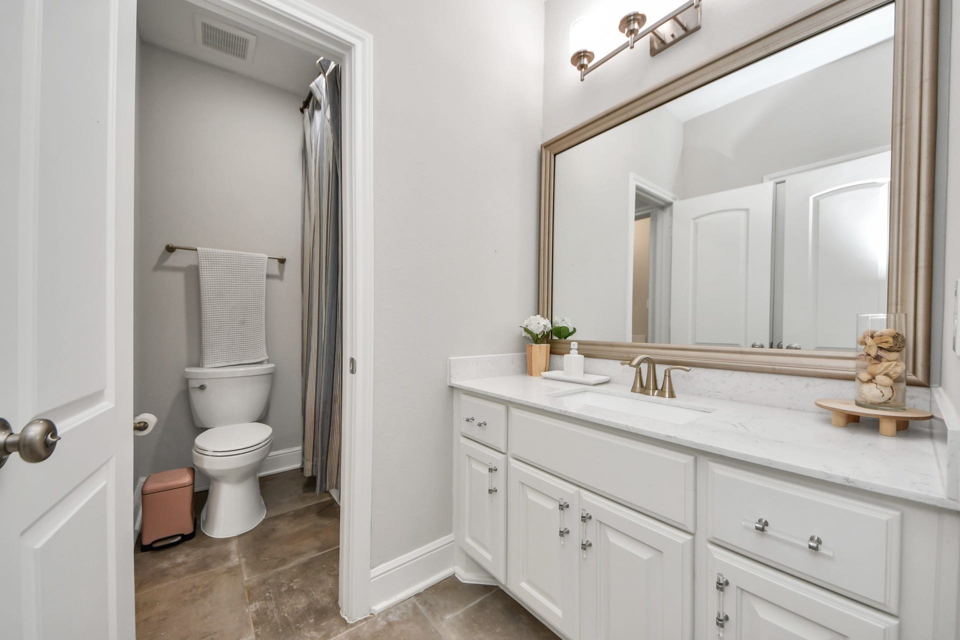 12821 N Palomino Lake Circle, Cypress, TX 77429 Spacious upstairs bathroom featuring an extended vanity, ample cabinet storage, and convenient hallway access for both secondary bedrooms, the game room, and study.