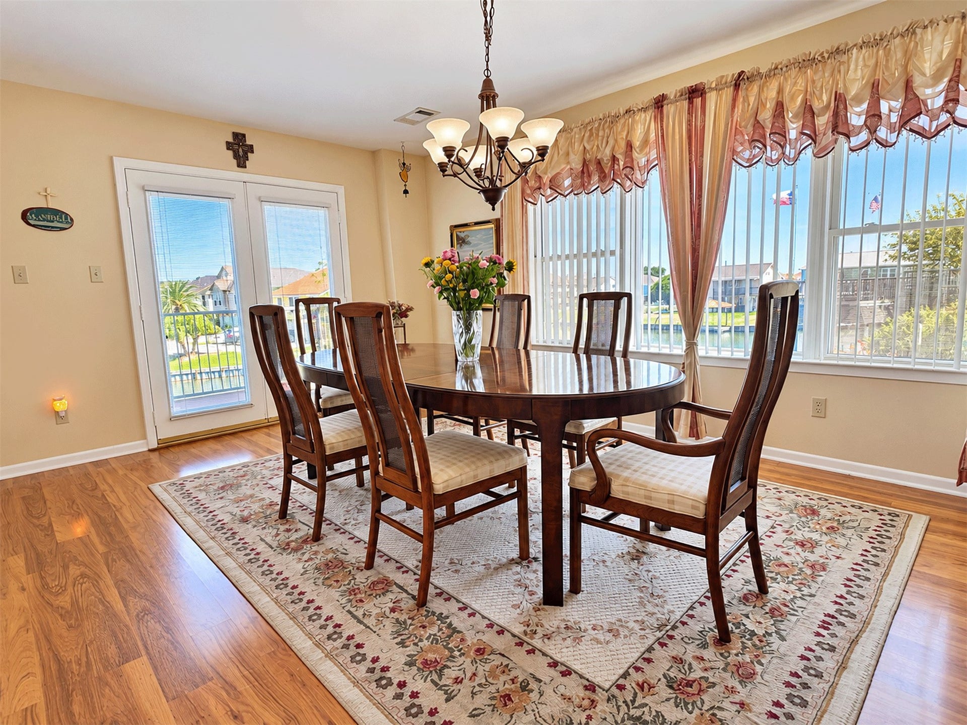 7 S Skimmer Street, La Marque, TX 77568 Dining room with French doors leading out to the deck and water views.
