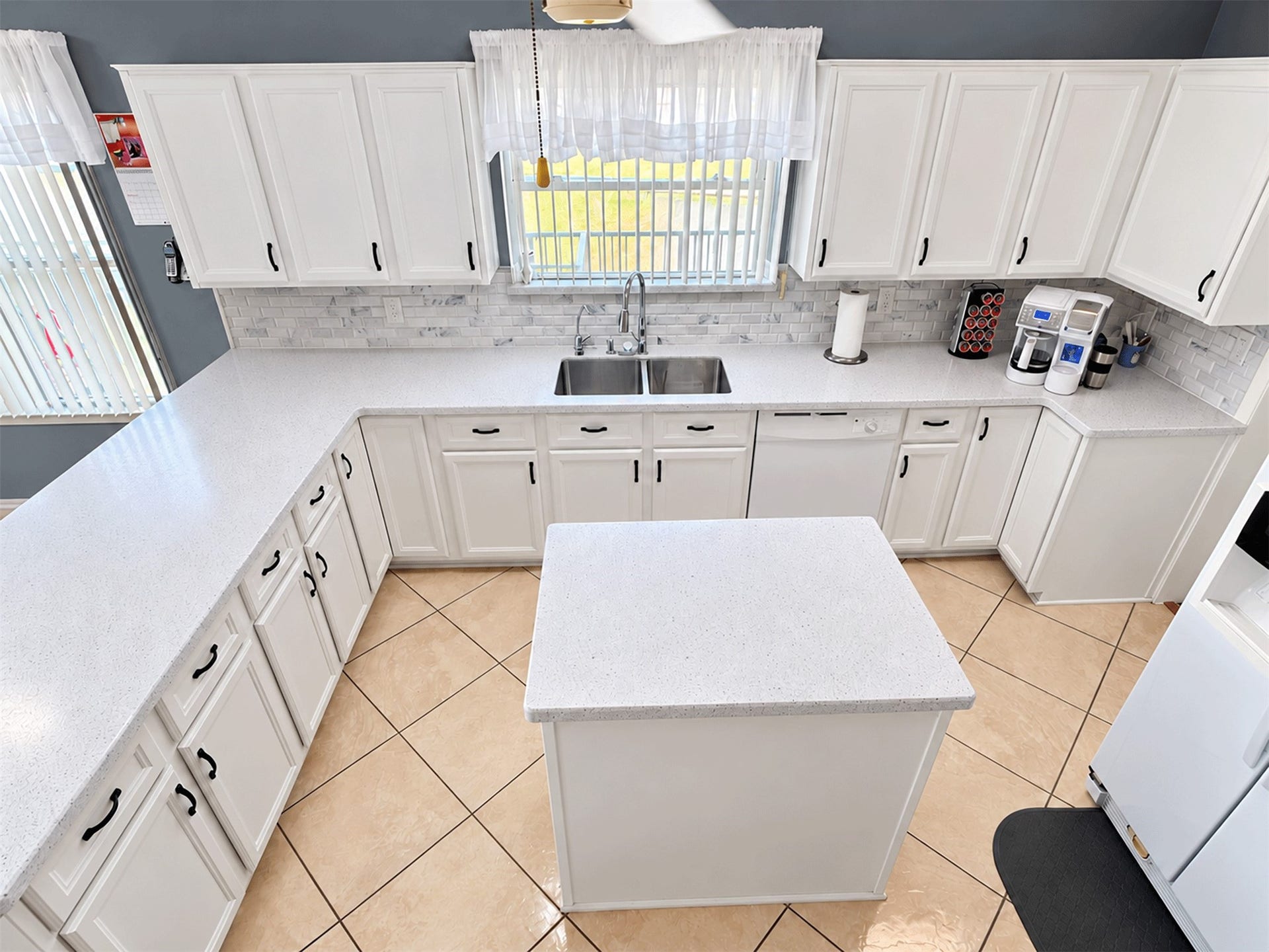 7 S Skimmer Street, La Marque, TX 77568 Upgraded kitchen with new cabinet doors, soft-close drawers, and a large center island.