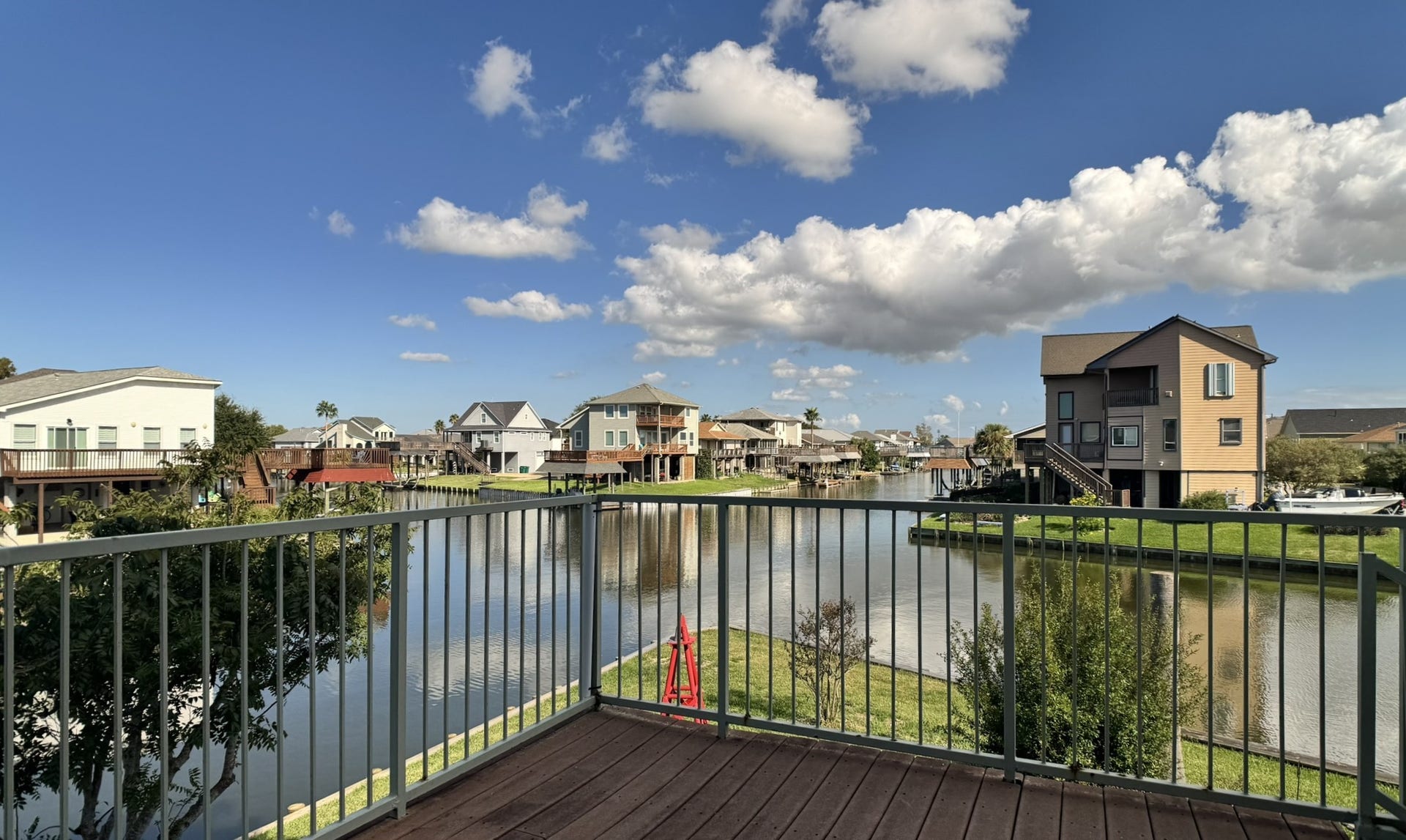 7 S Skimmer Street, La Marque, TX 77568 Step out onto the covered-free corner deck and take in open canal views in both directions. The perfect spot for morning coffee or watching the boats go by.