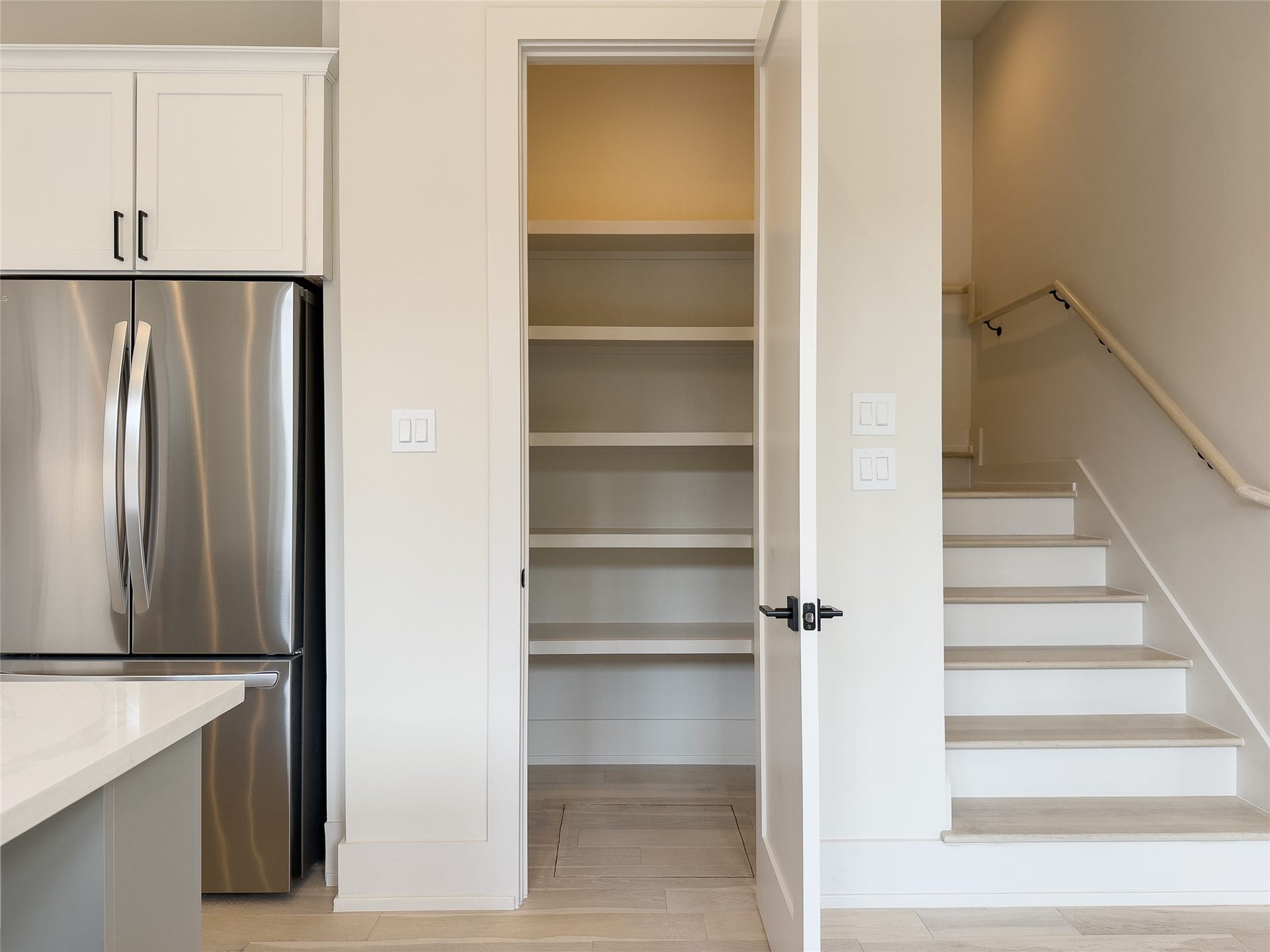 Pantry with crawl space access on floor. Stairs to 2nd floor, zoned HVAC w/smart thermostat on each floor.