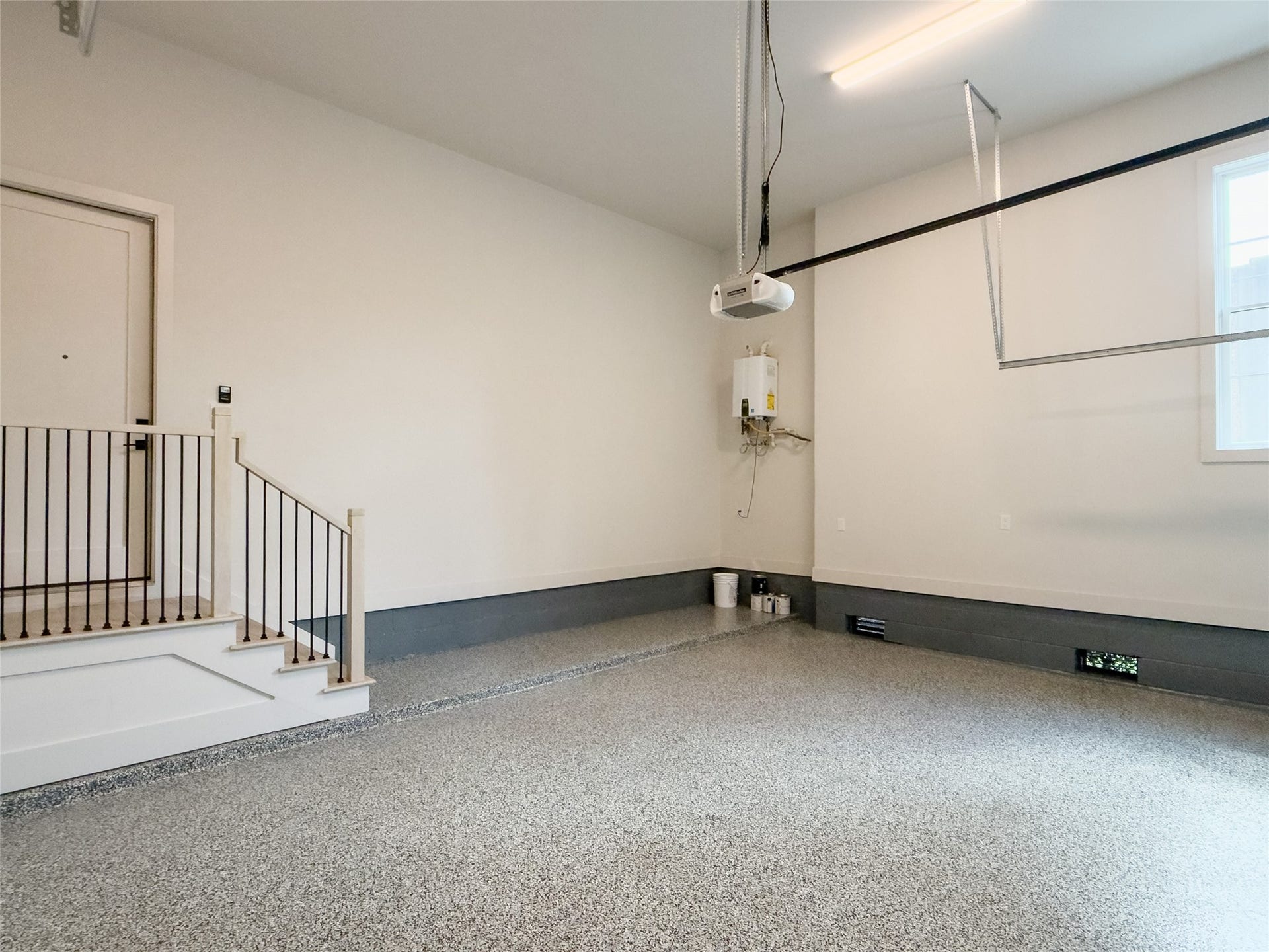 tankless water heater, window to allow natural light for brighter space, extra-high ceiling