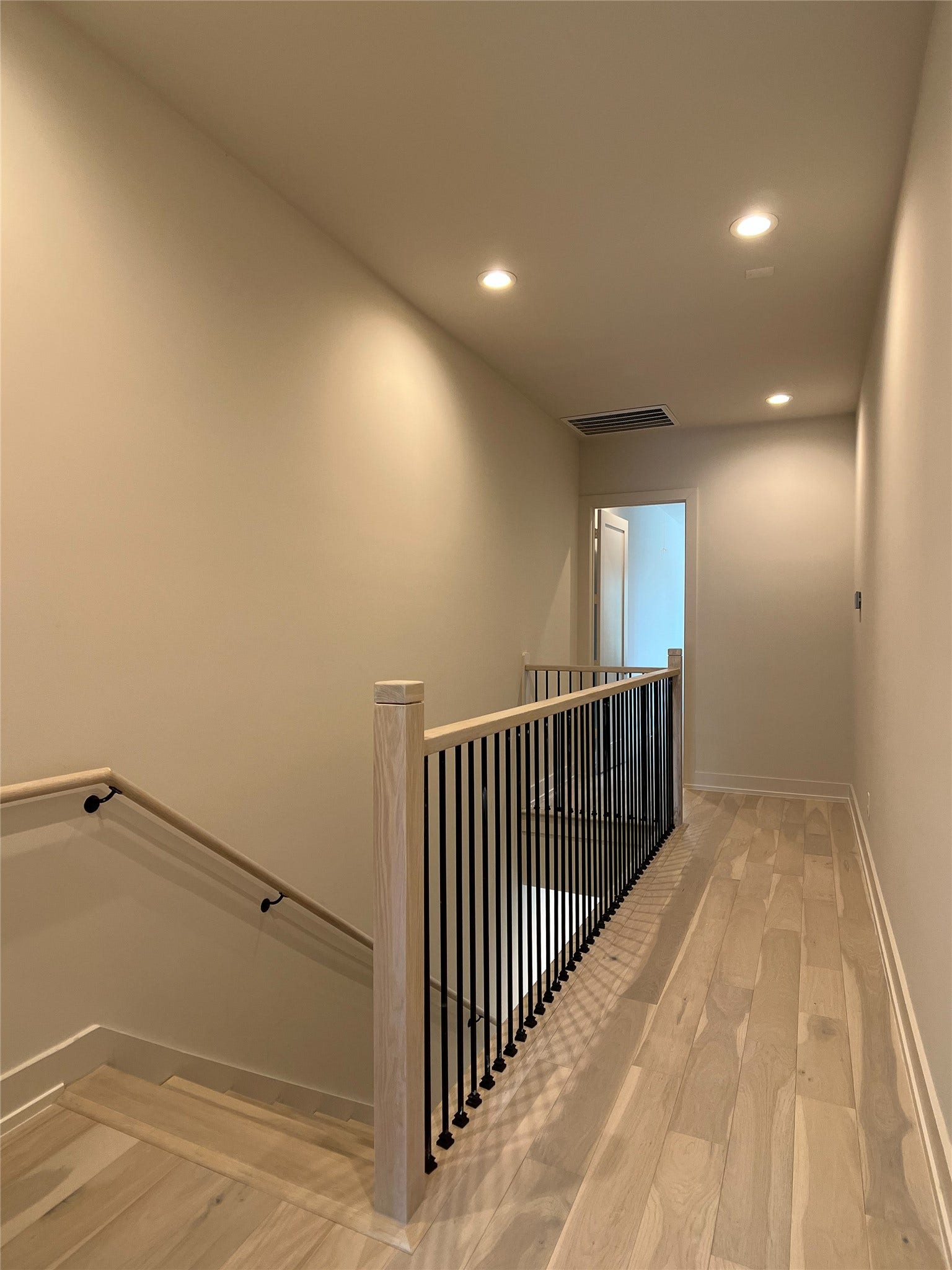 upstairs hall: owner's suite on one end, 2 secondary bedrooms & bath on other end