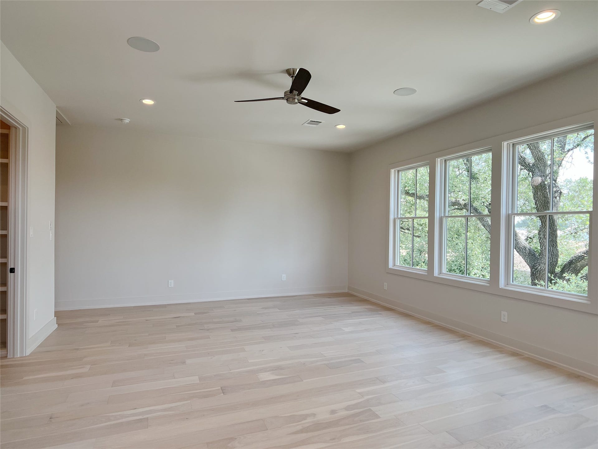 enormous owner's bedroom w/storybook views out the front windows of stately oak tree & courtyard