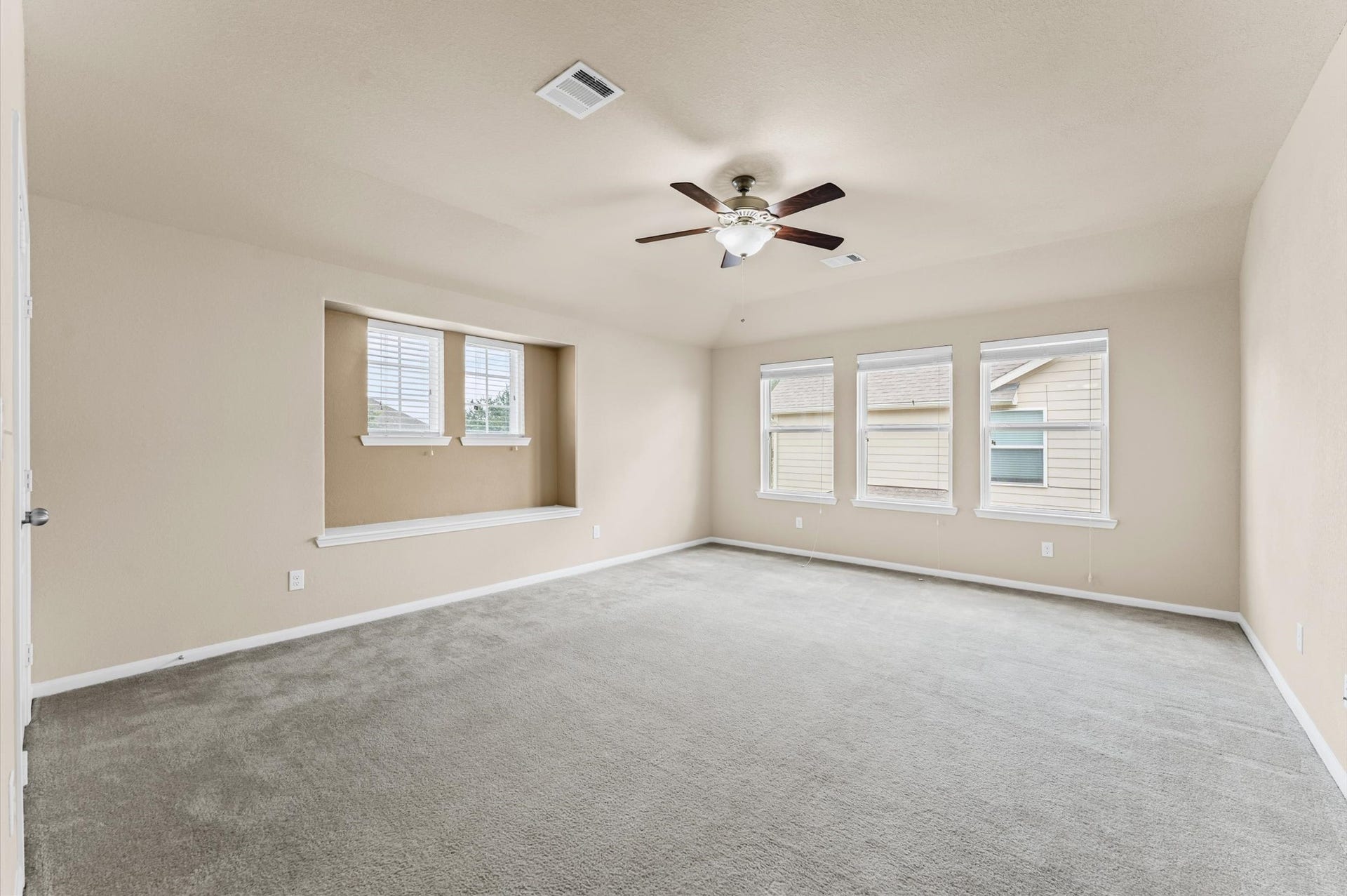 Upstairs, a 17x15 game room surrounded by three bedrooms.