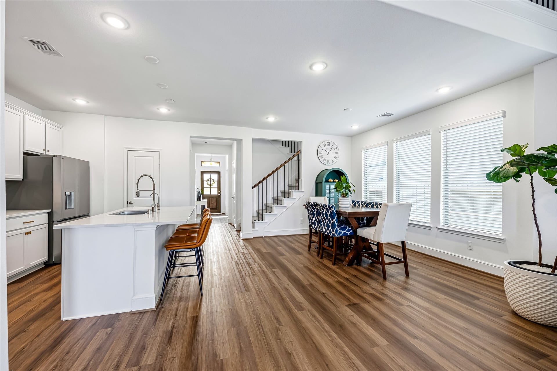 3573 Cherrybark Gable Lane, Spring, TX 77386 A spacious casual dining area sits beside the island kitchen, with generous windows and upgraded flooring extending throughout the space.