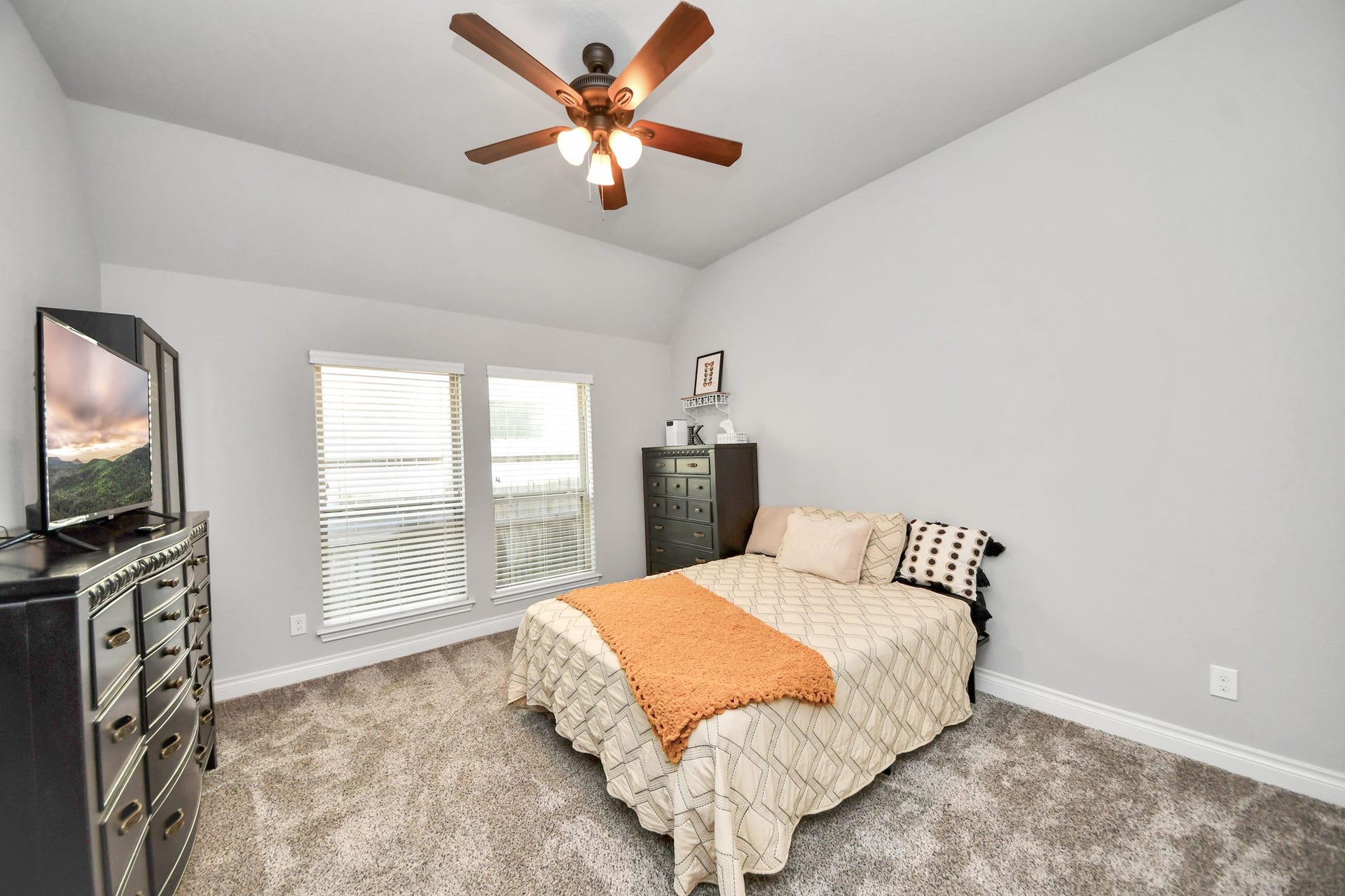 3211 Sweet Audrey Lane, Richmond, TX 77406 Bedroom #3 with plush carpet, ceiling fan, and two windows for natural light.