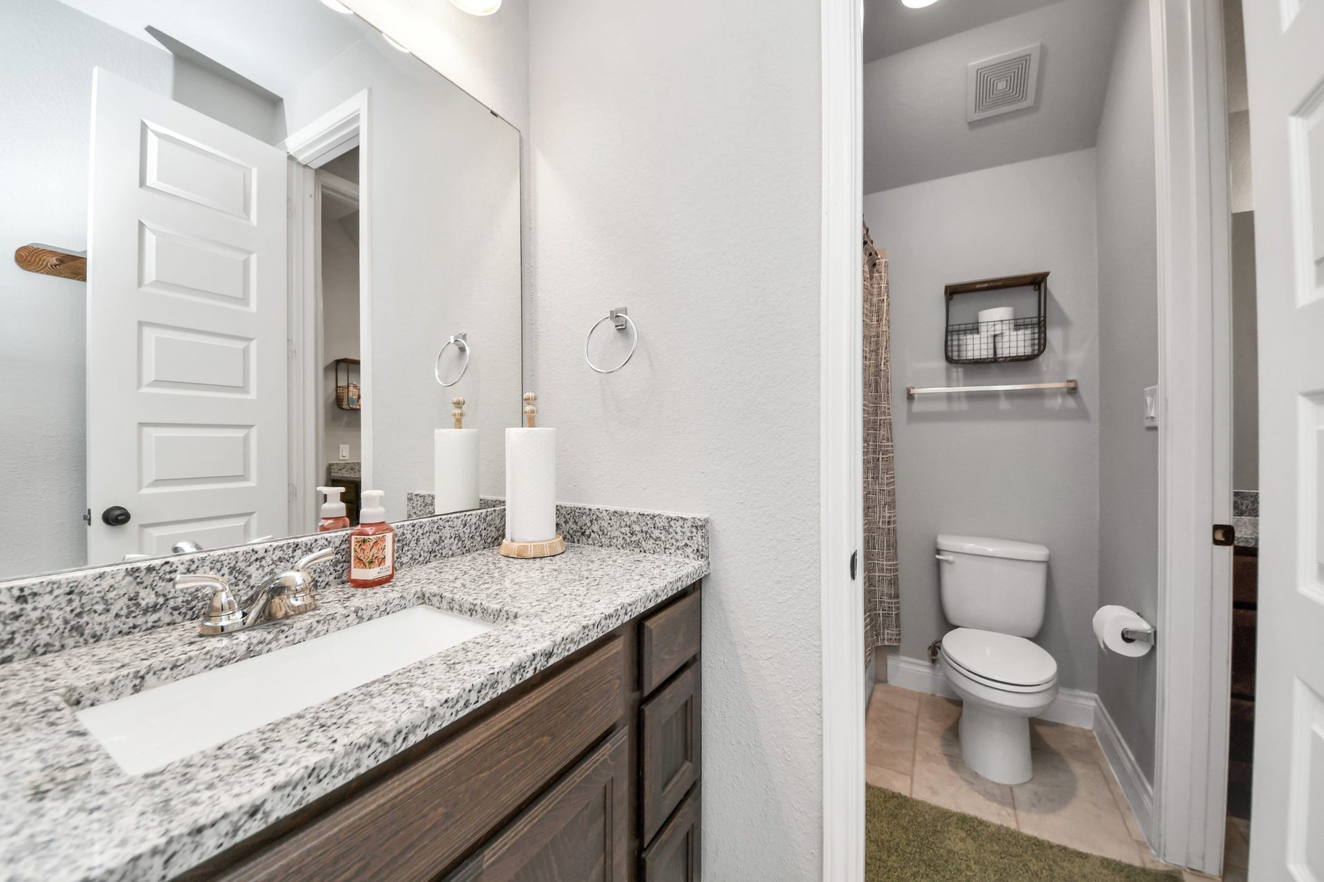 3211 Sweet Audrey Lane, Richmond, TX 77406 The washroom and shower/tub combo are separate from private sink areas in this jack-and-jill bathroom.