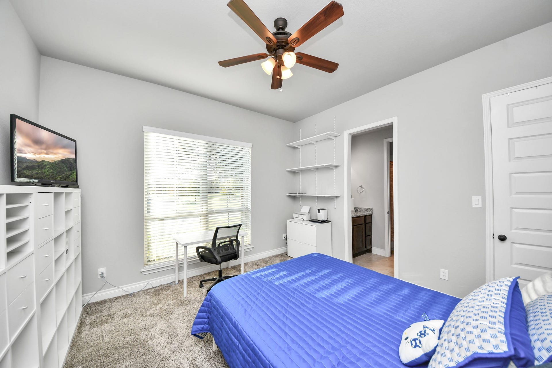 3211 Sweet Audrey Lane, Richmond, TX 77406 Front bedroom (Bedroom #2) with carpet, ceiling fan, and its own private sink area.