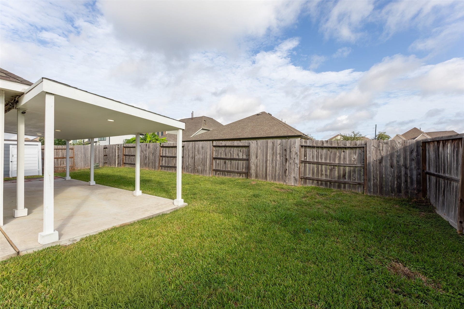 2610 Blue Abbot Drive, Fresno, TX 77545 Relaxation, surrounded by a wooden privacy fence.