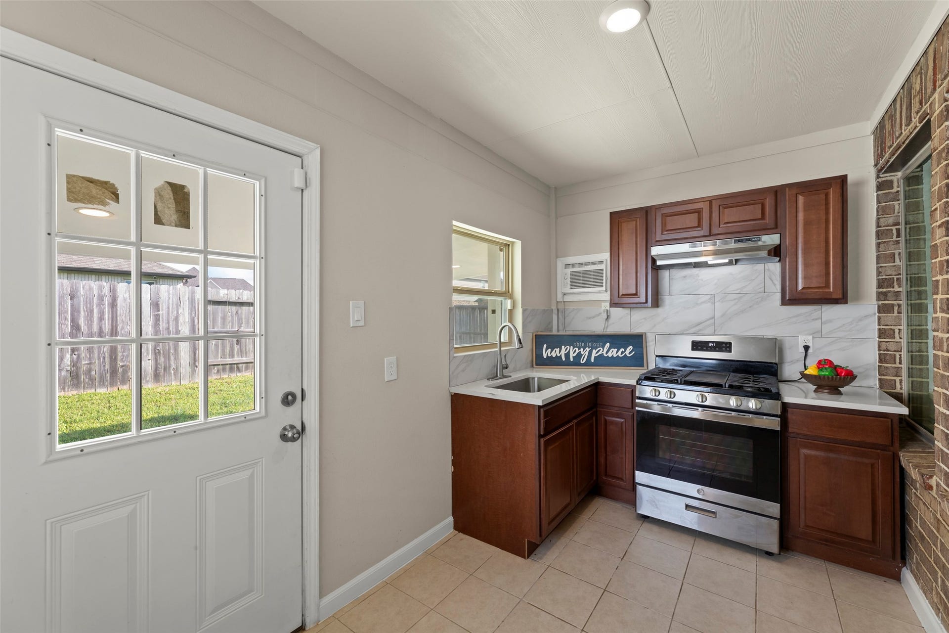 2610 Blue Abbot Drive, Fresno, TX 77545 Charming door leading to a serene backyard.